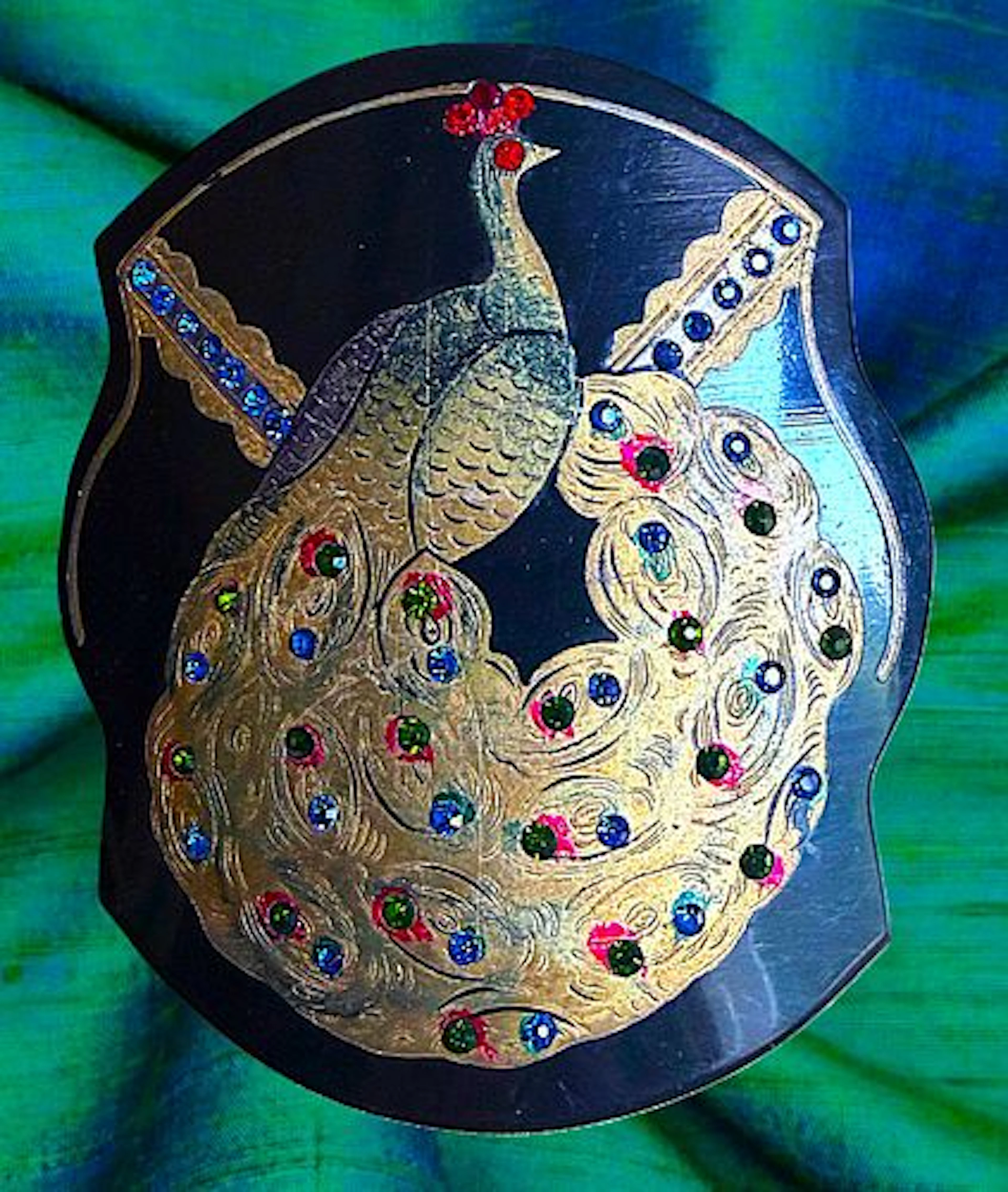 A DIVISION ONE JEWELED AND PAINTED PEACOCK