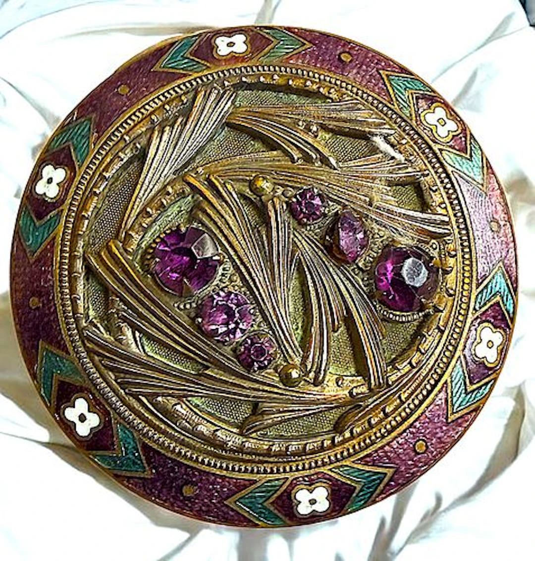 A DIVISION ONE ORNATE JEWLED BUTTON