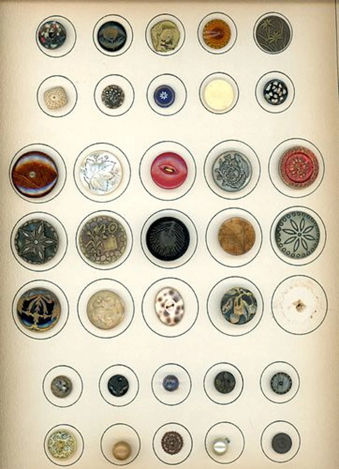A CARD OF DIVISION ONE ASSORTED MATERIAL BUTTONS