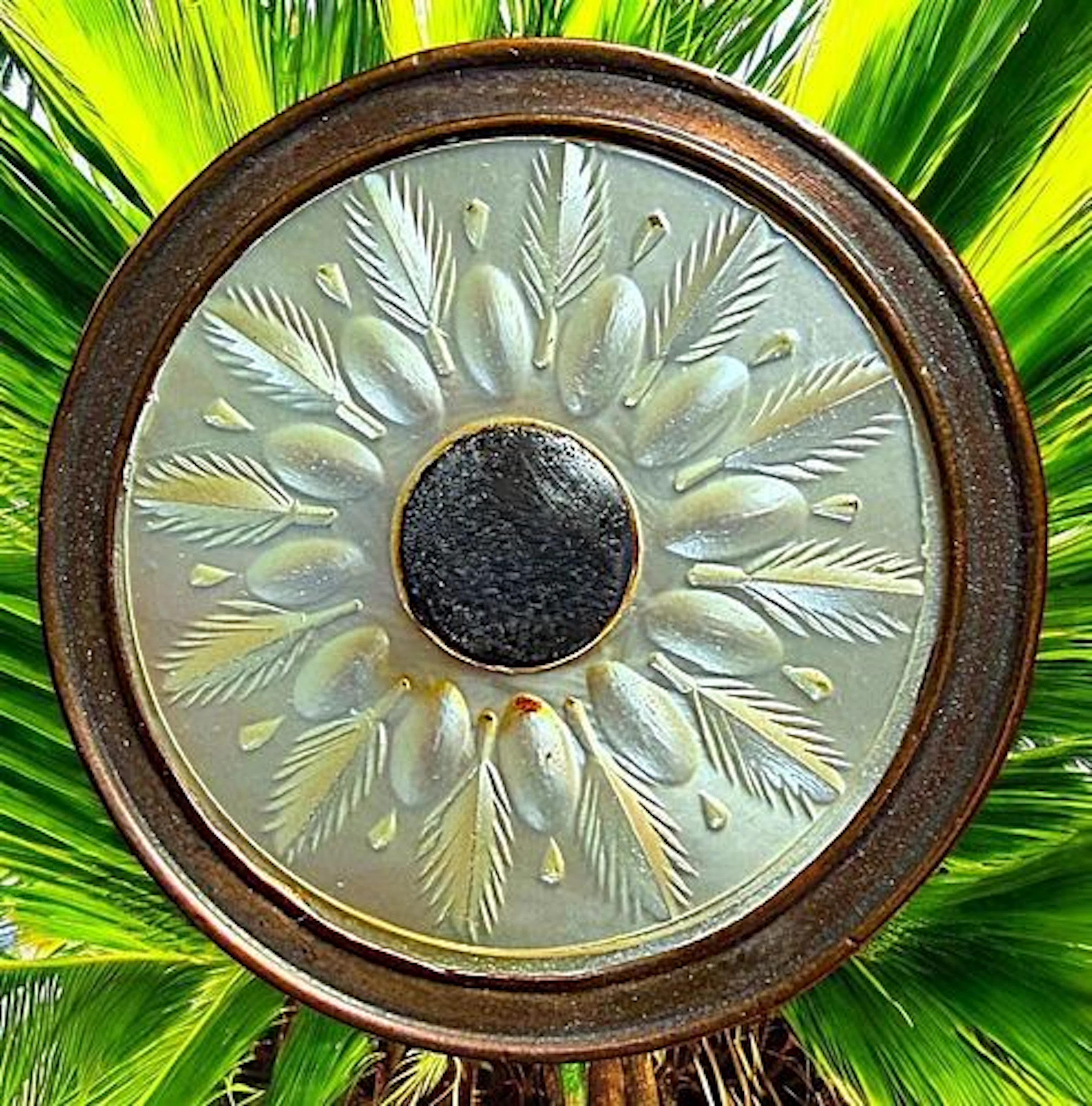 A DIVISON ONE PEARL-COPPER AND STEEL BUTTON