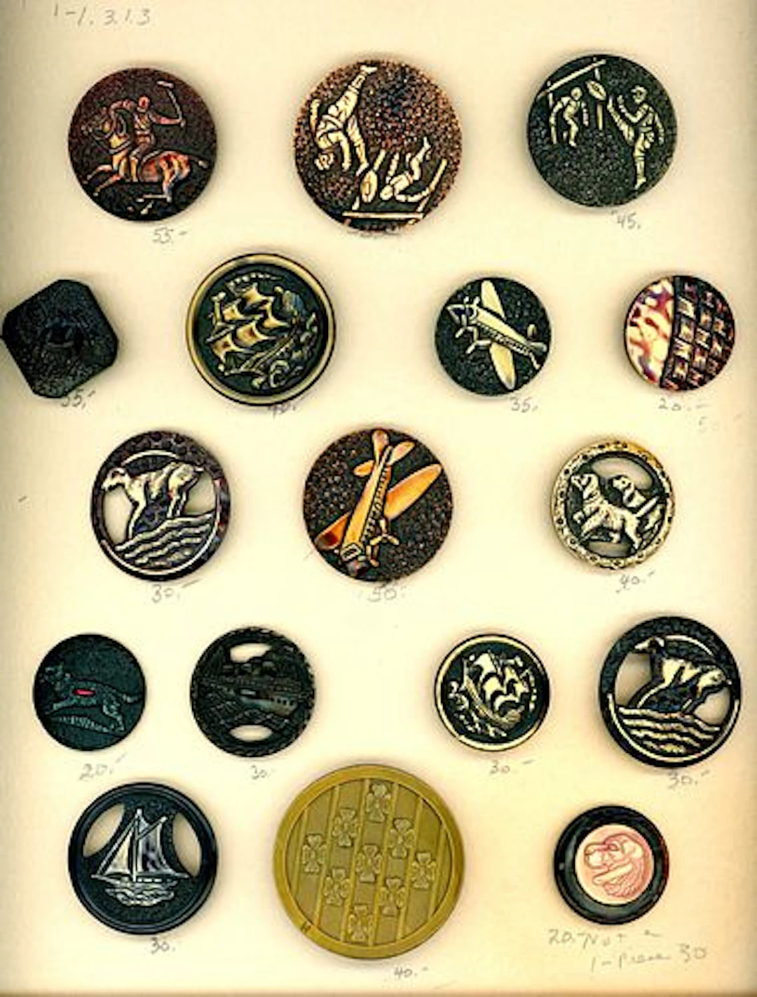 A CARD OF DIVISION THREE CELLULOID PICTORIAL BUTTONS
