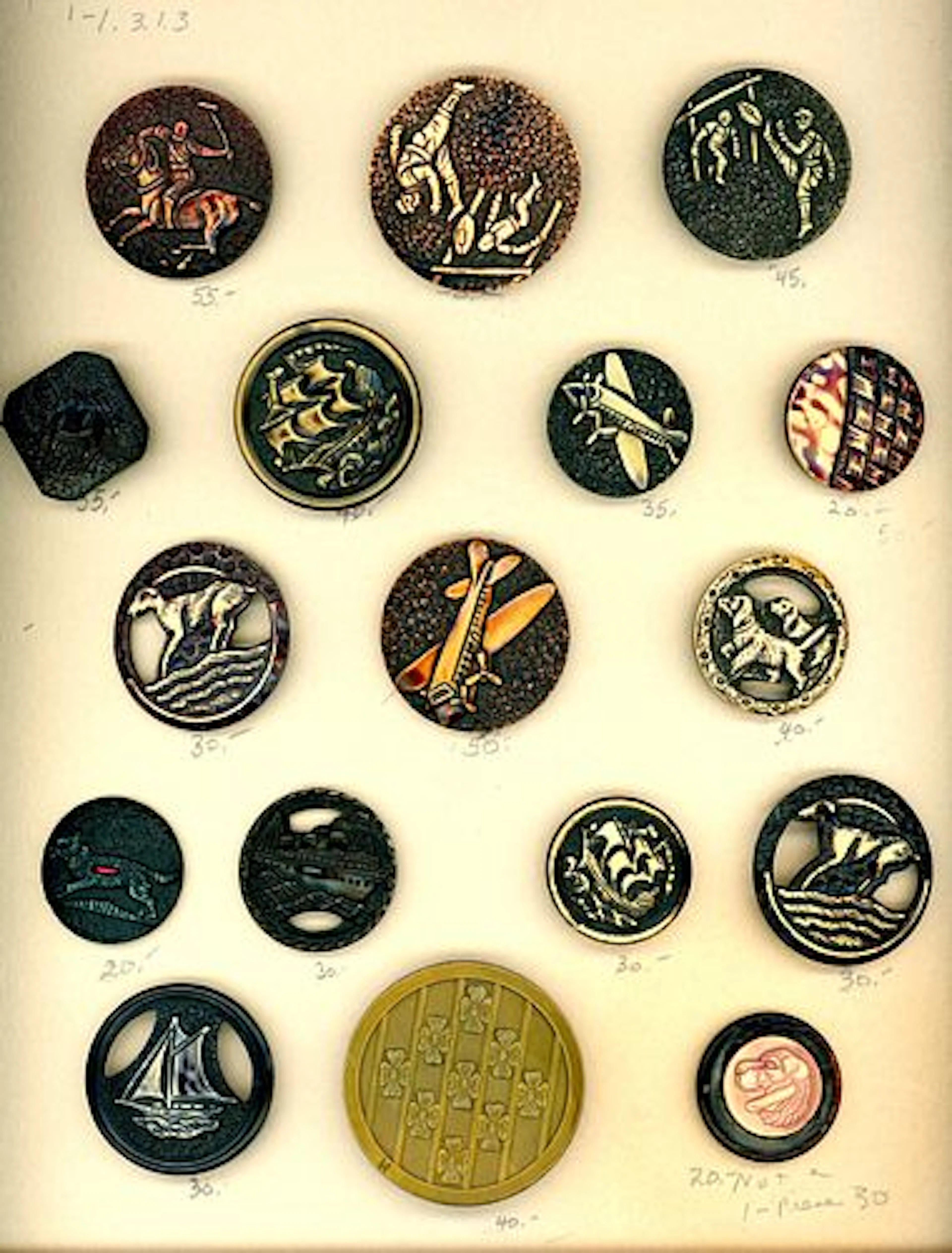 A CARD OF DIVISION THREE CELLULOID PICTORIAL BUTTONS