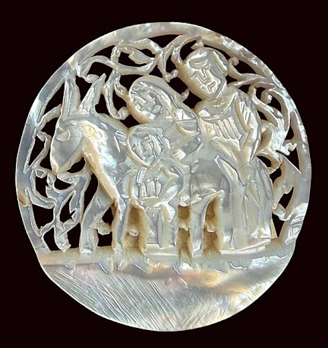 A DIVISION THREE CARVED PEARL PICTORIAL BUTTON