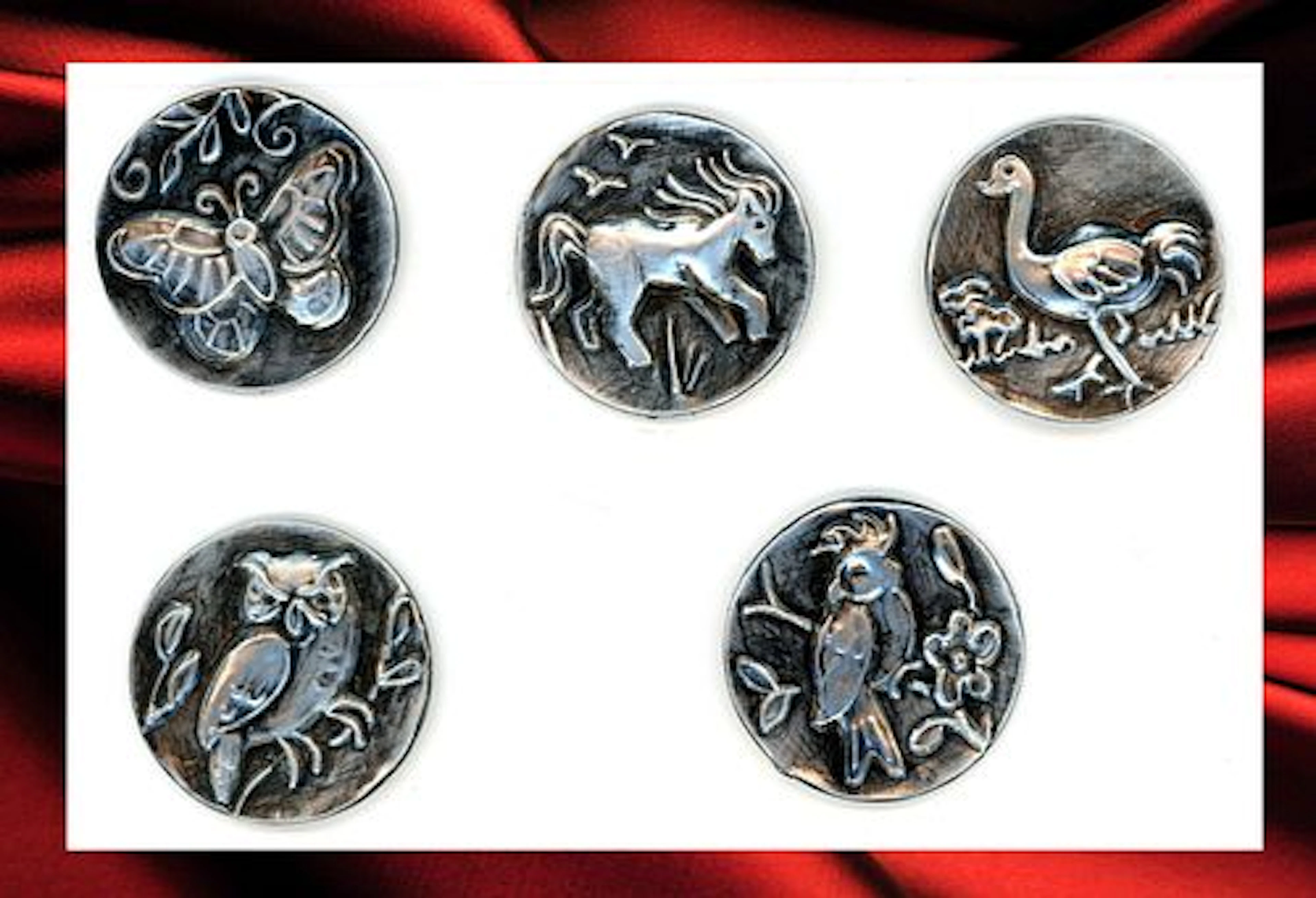 A SMALL CARD OF DIVISION THREE PICTORIAL BUTTONS