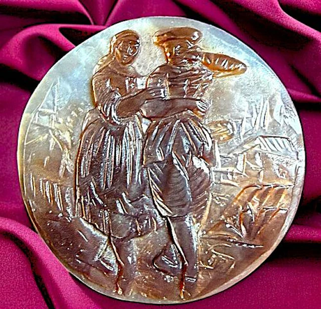A DIVISION ONE PICTORIAL CARVED PEARL BUTTON