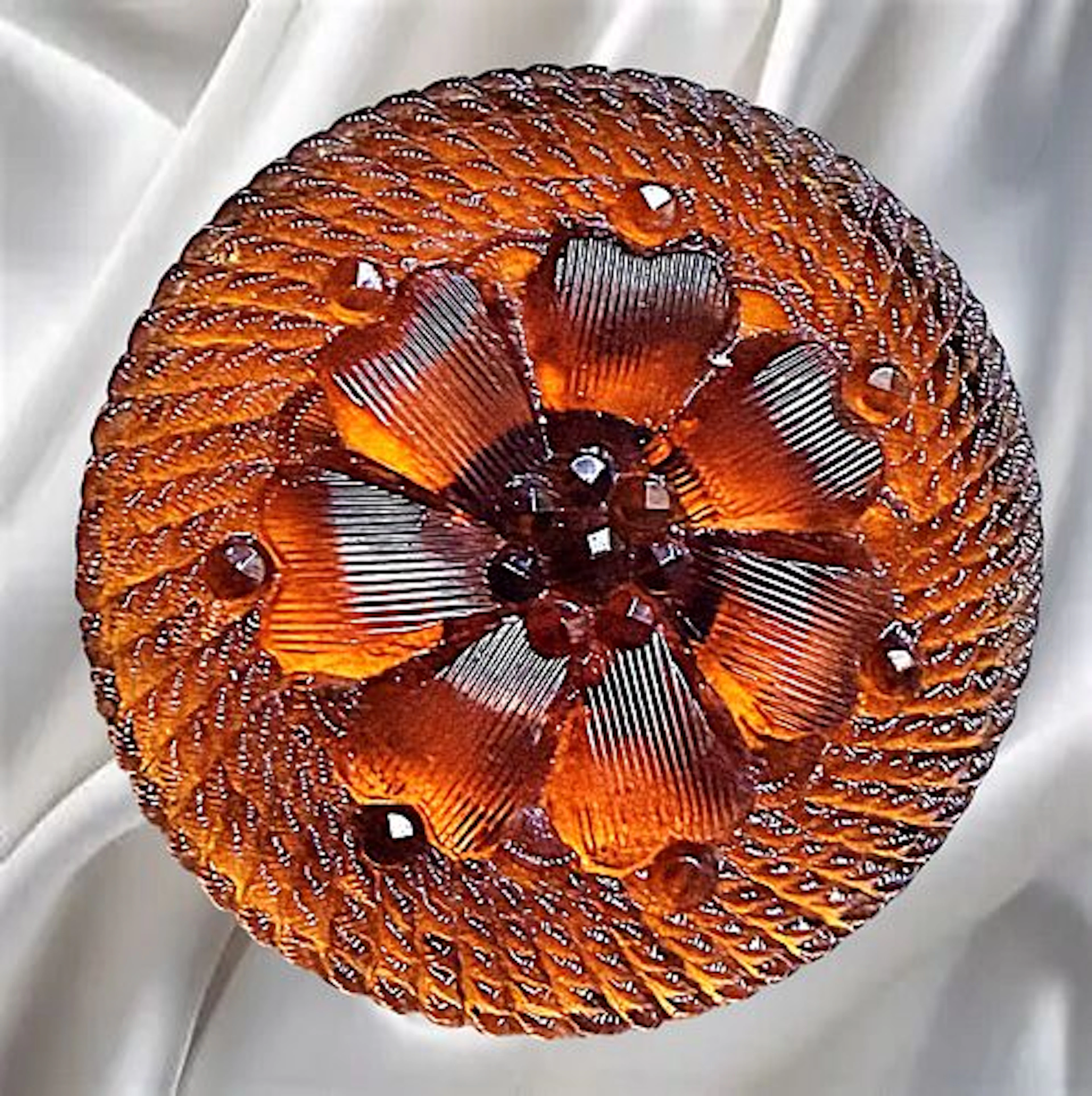 A DIVISION ONE FULL BODY COLORED LACY GLASS BUTTON
