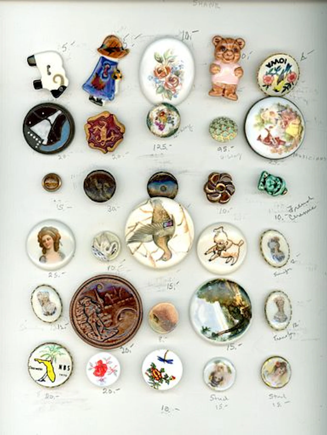 A CARD OF DIVISION ONE AND THREE CERAMIC BUTTONS