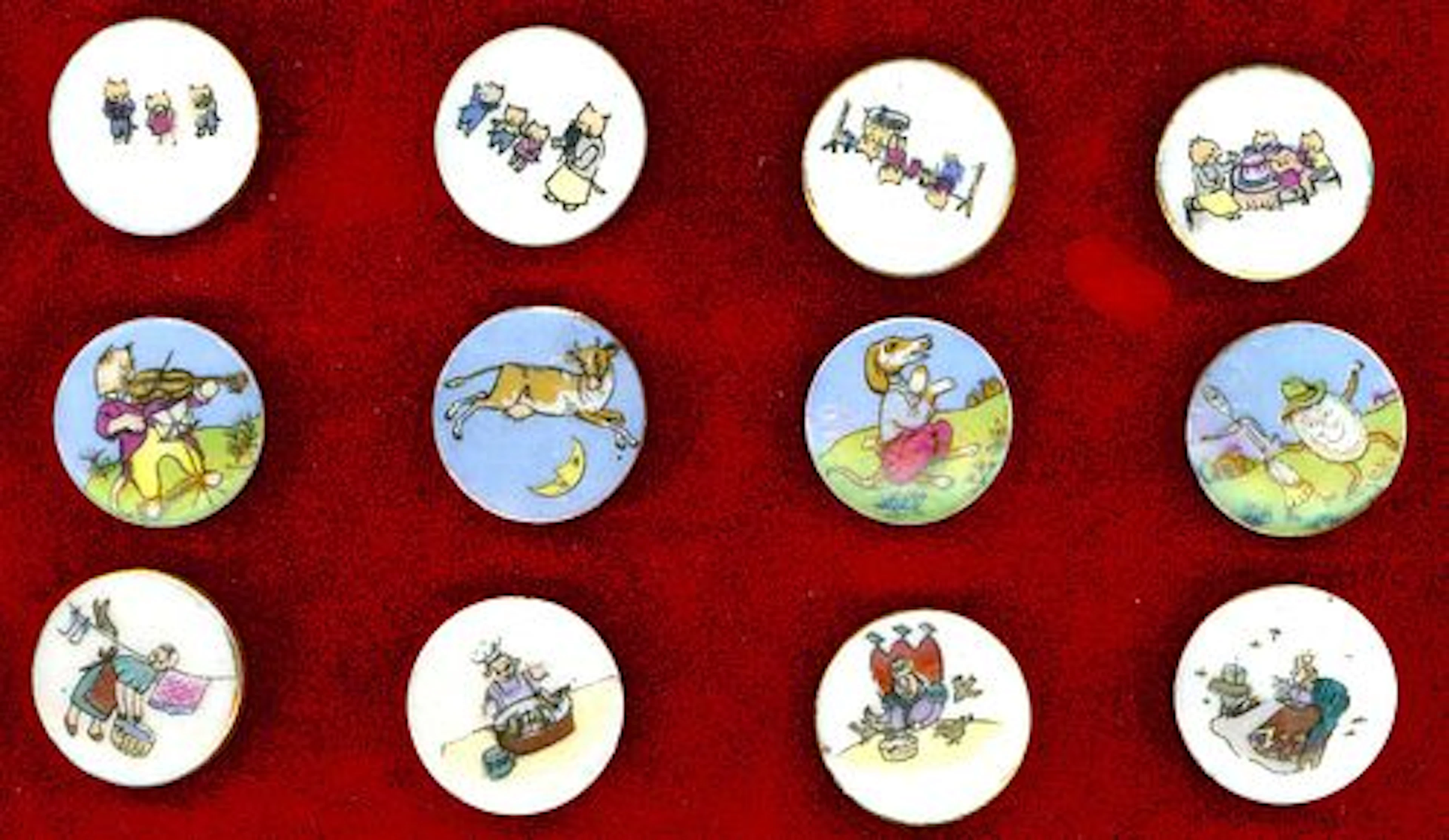 A SMALL CARD OF DIVISION THREE NURSERY RHYME BUTTONS