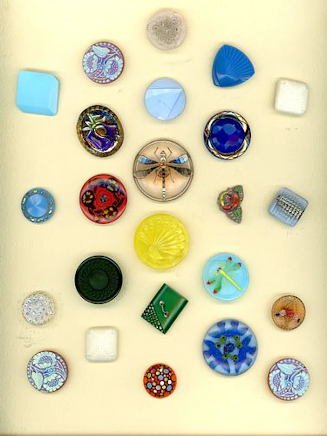 A CARD OF DIVISION THREE CZECH GLASS BUTTONS