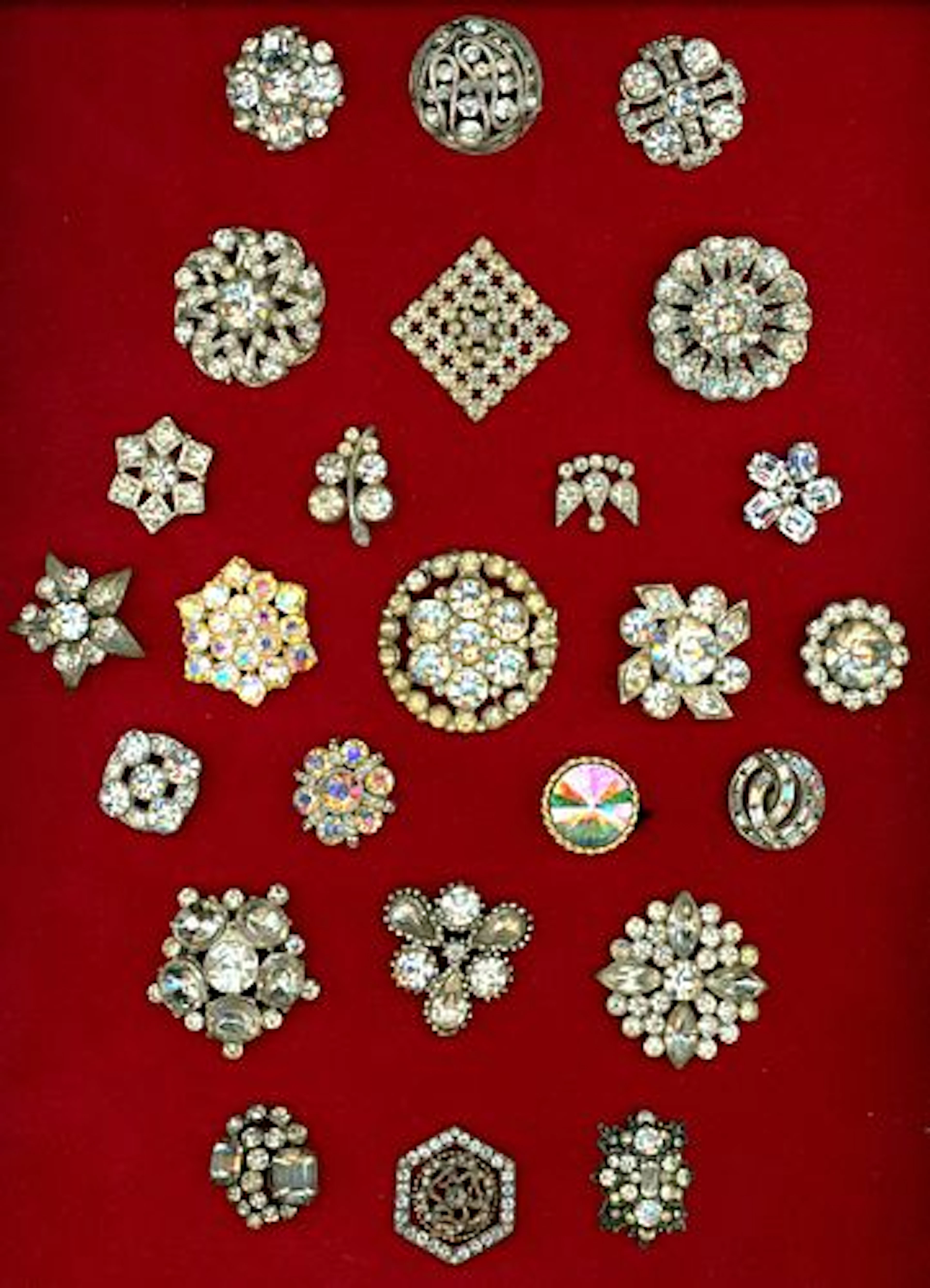 A CARD OF DIVISION ONE AND THREE JEWELED BUTTONS