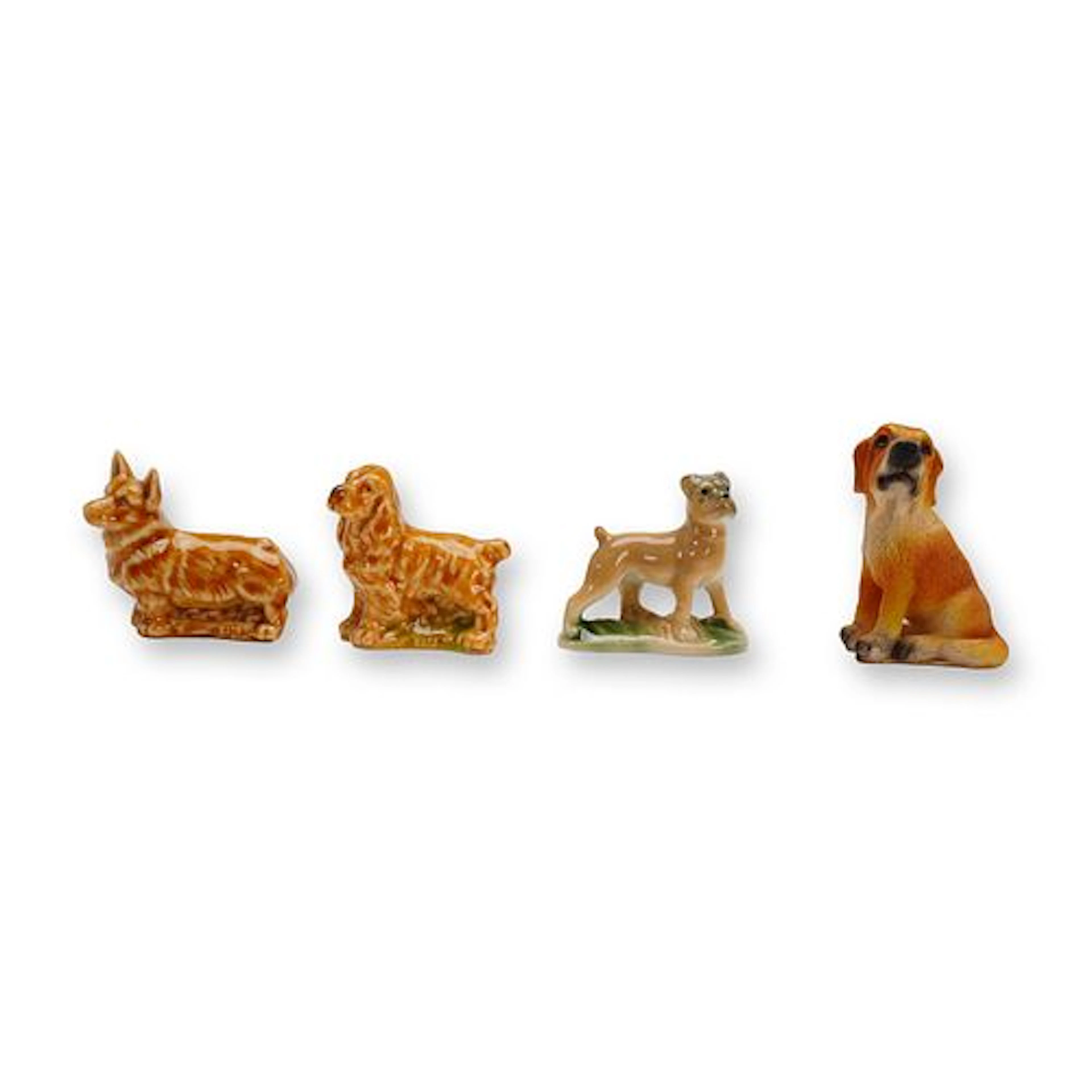 A Collection of 4 Miniature Ceramic and Resin Dog Figurines