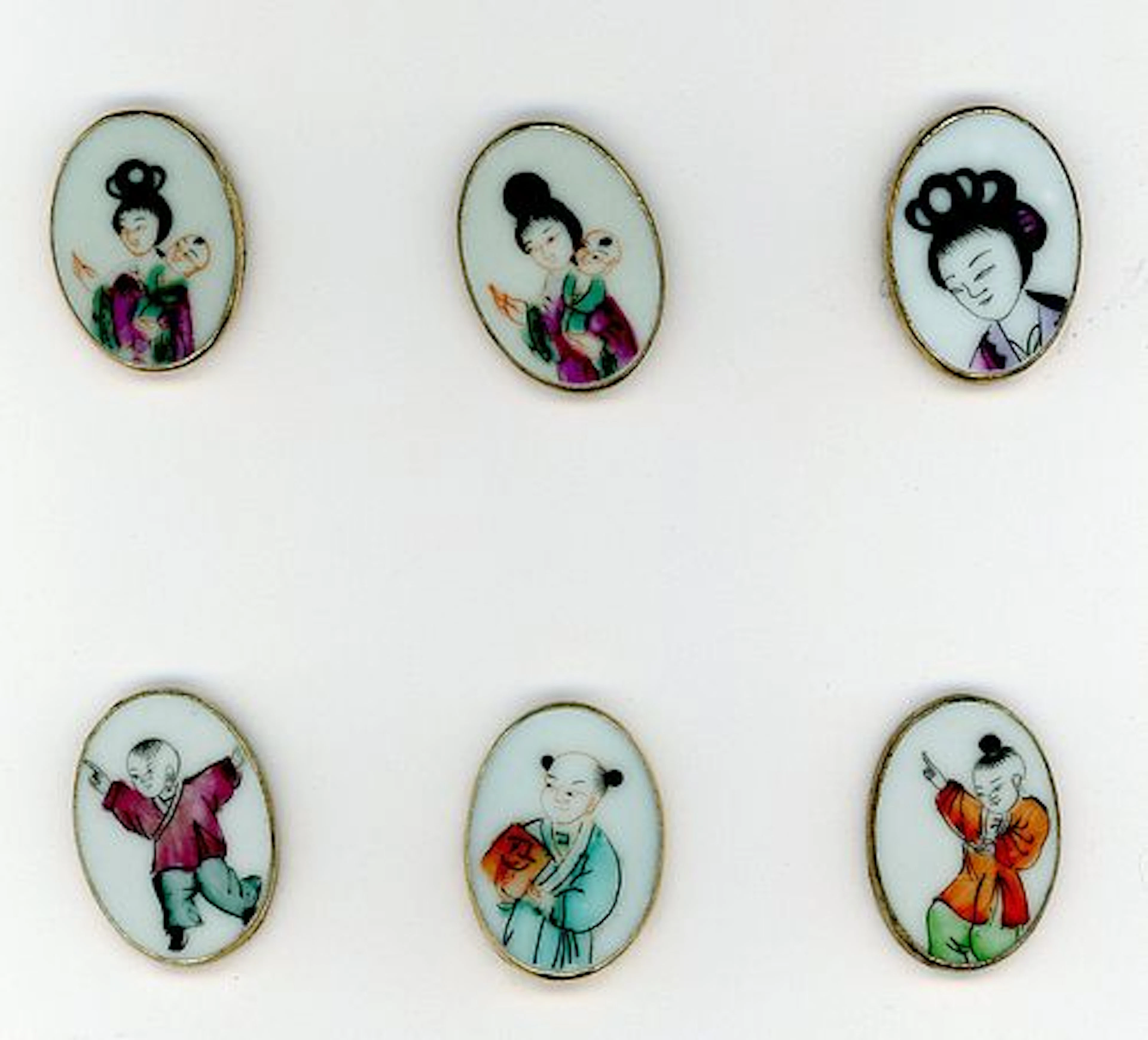 A CARD OF DIVISION THREE CERAMIC BUTTONS