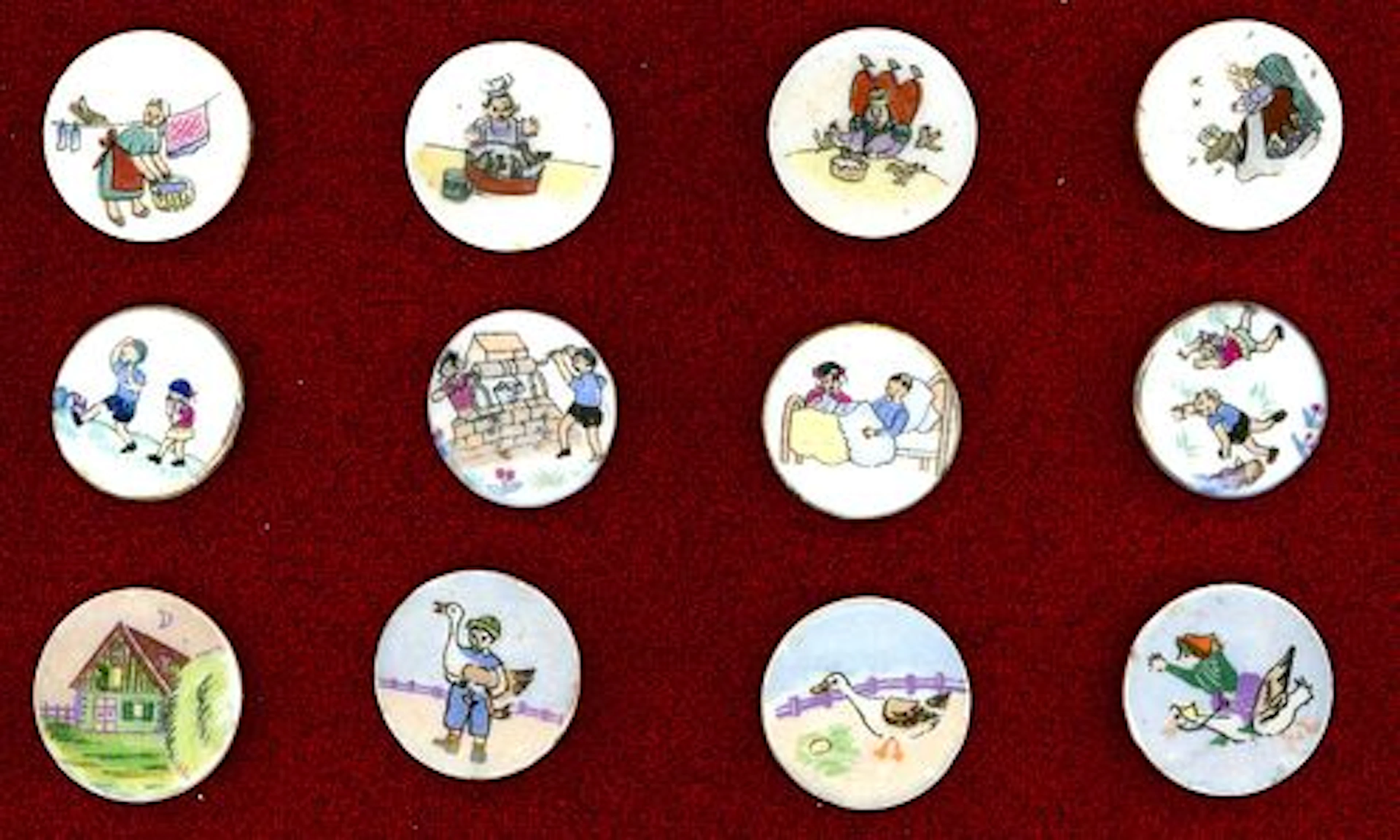A SMALL CARD OF DIVISION THREE NURSERY RHYME BUTTONS