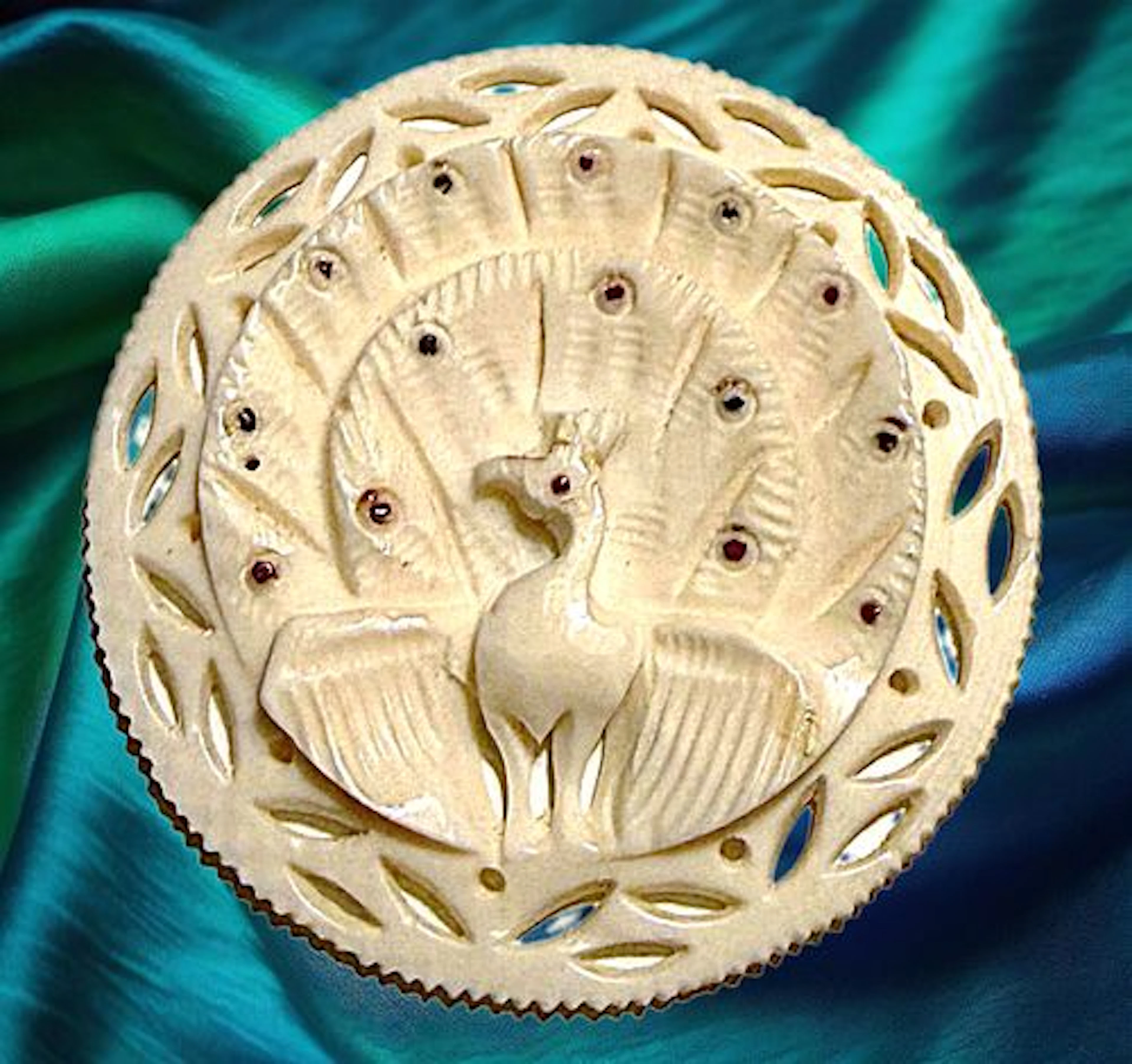 A DIVISION THREE PIERCED & CARVED ANIMAL BUTTON