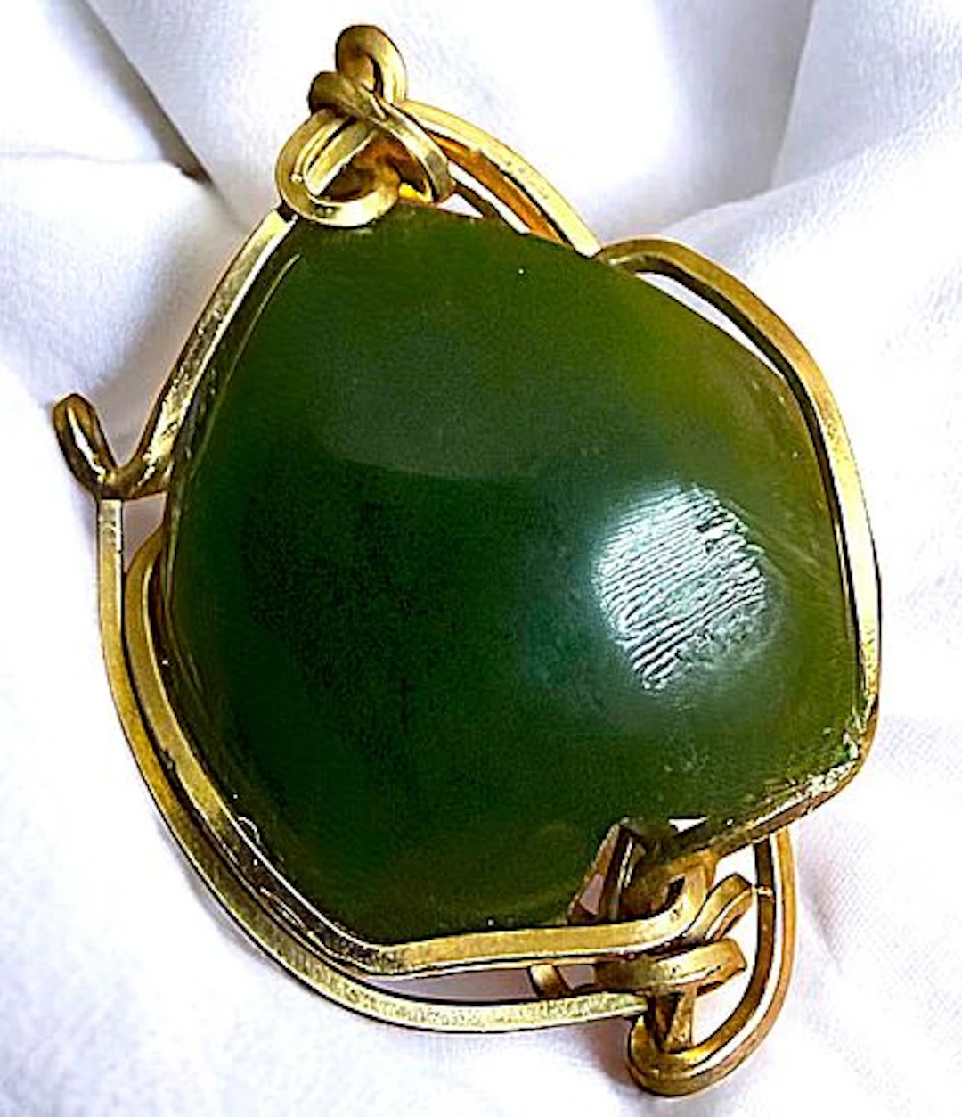 A DIVISION THREE GEMSTONE SET IN GOLD