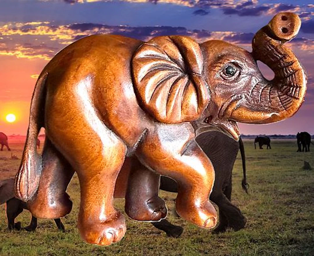 A CARVED JAPANESE WOOD NETSUKE ANIMAL