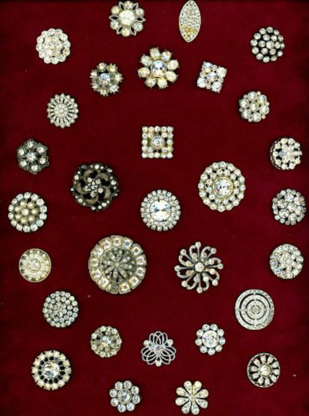 A CARD OF DIVISION ONE & THREE JEWELED BUTTONS