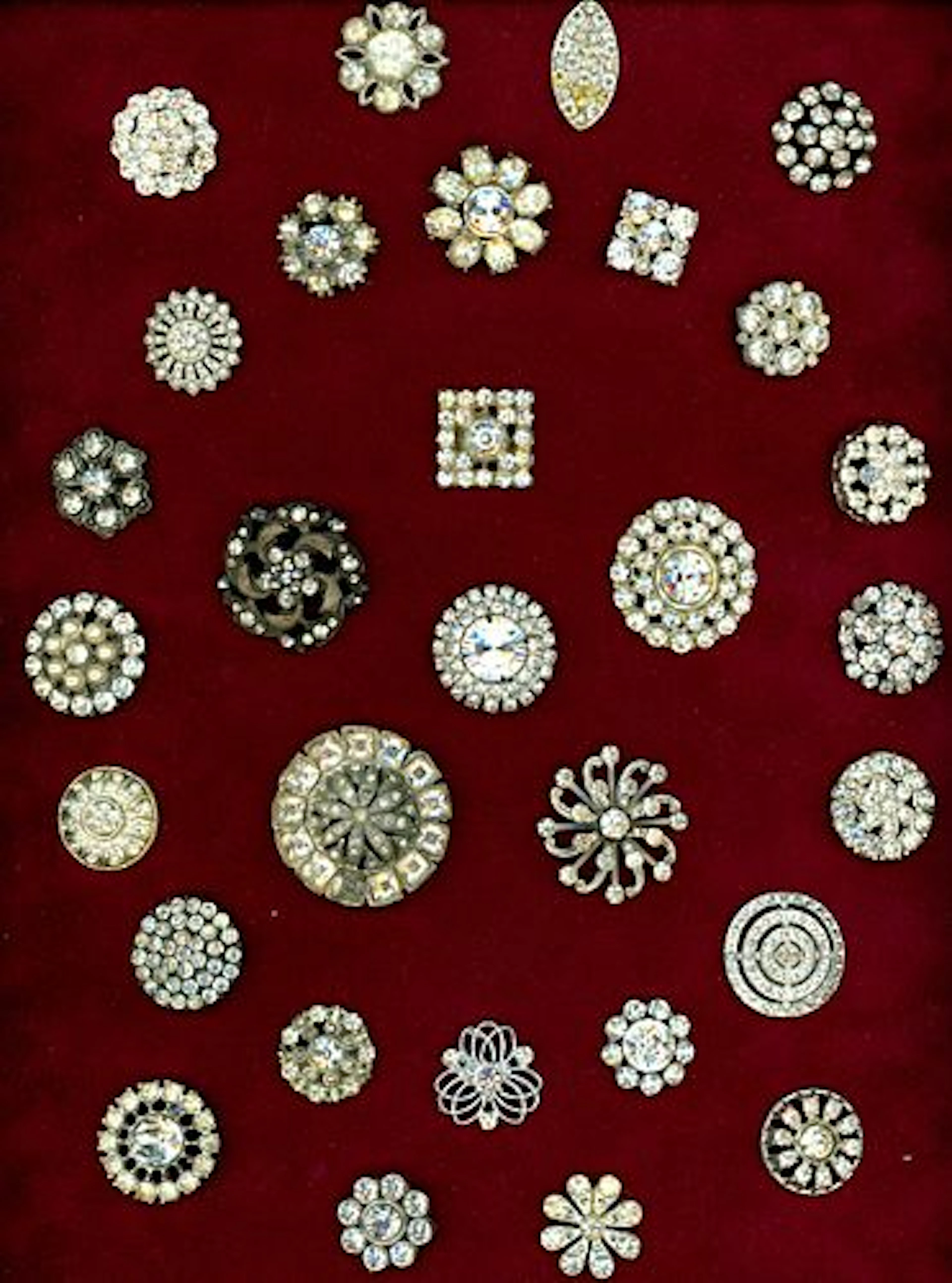 A CARD OF DIVISION ONE & THREE JEWELED BUTTONS
