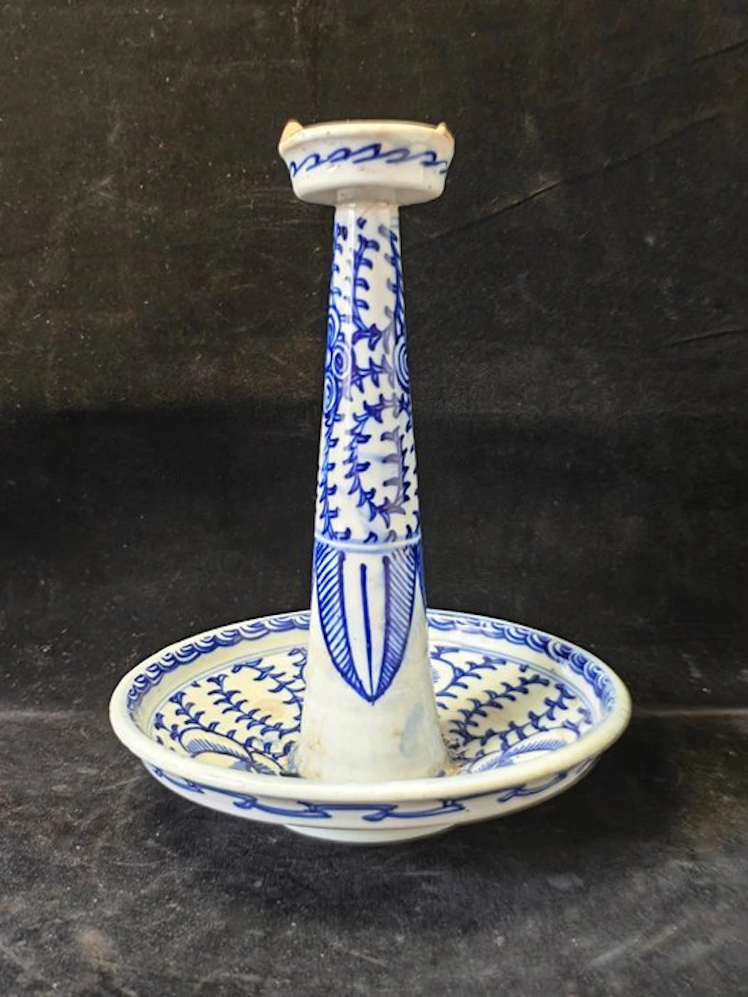 Blue and white high-stemmed candlestick with scrolling...