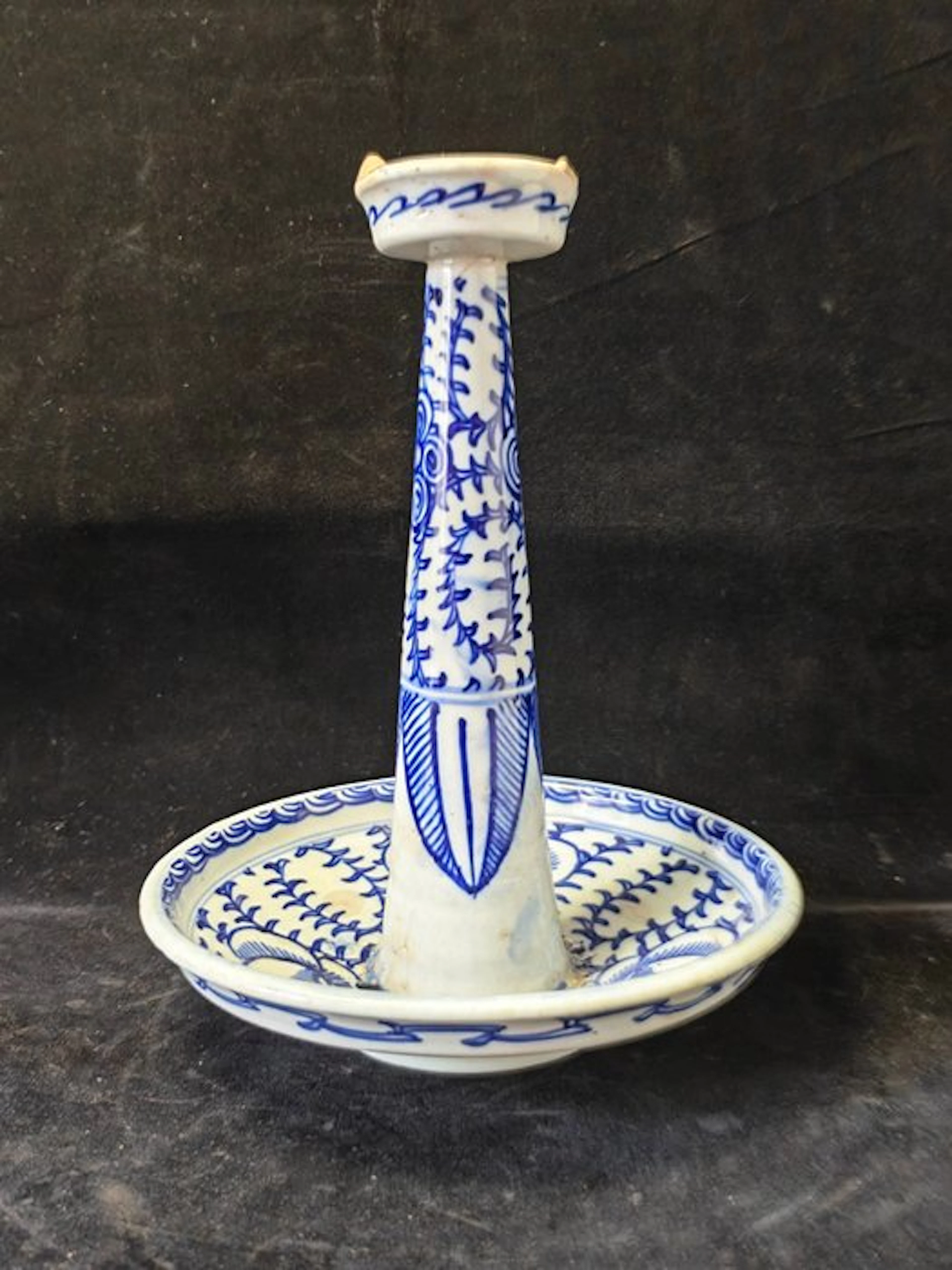 Blue and white high-stemmed candlestick with scrolling...