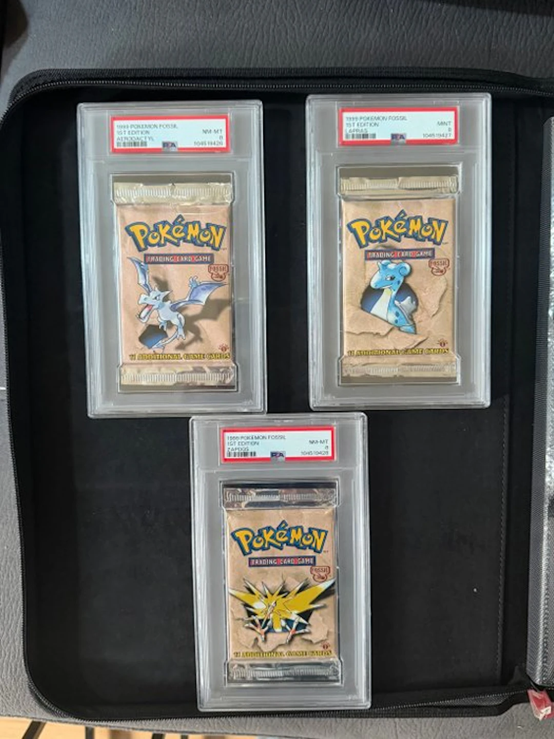 Pokémon - 3 Graded booster pack - 1st edition fossil art...