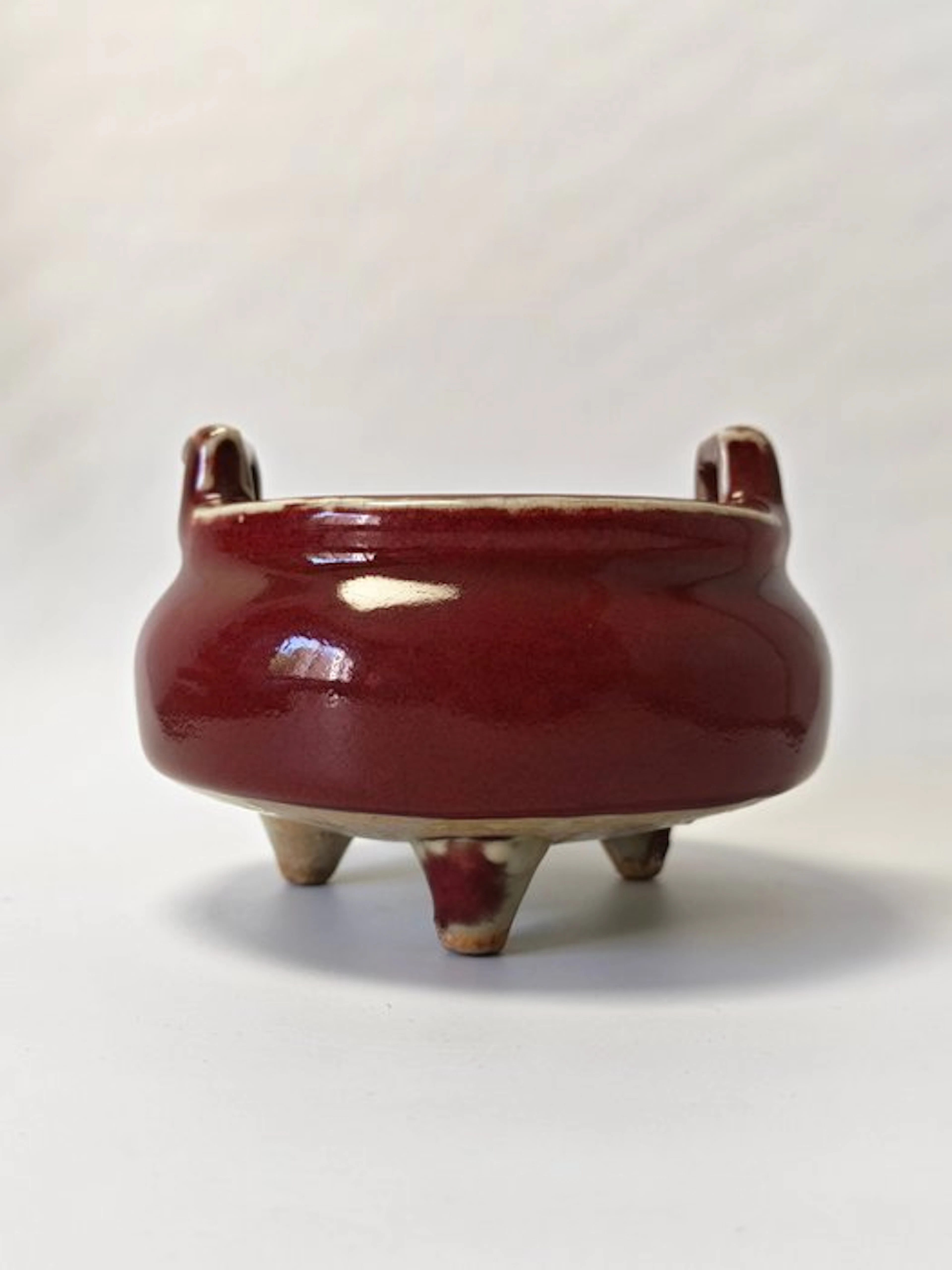 red glaze tripod censer with upright sky ears. - Ceramic - China - 20th century