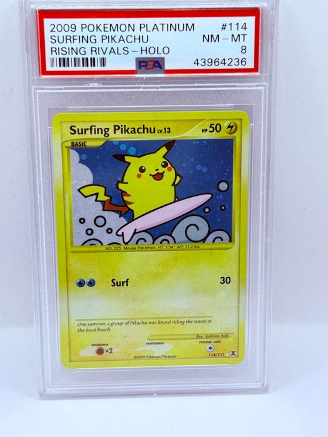 Pokémon - 1 Graded card - Surfing Pikachu 114/111 Foil - PSA 8 - Platinum