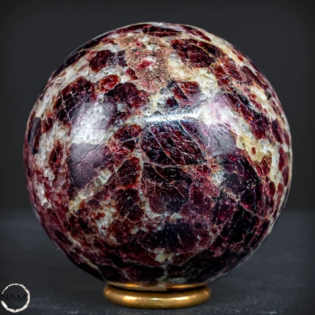 Natural garnet sphere with deep red crystals