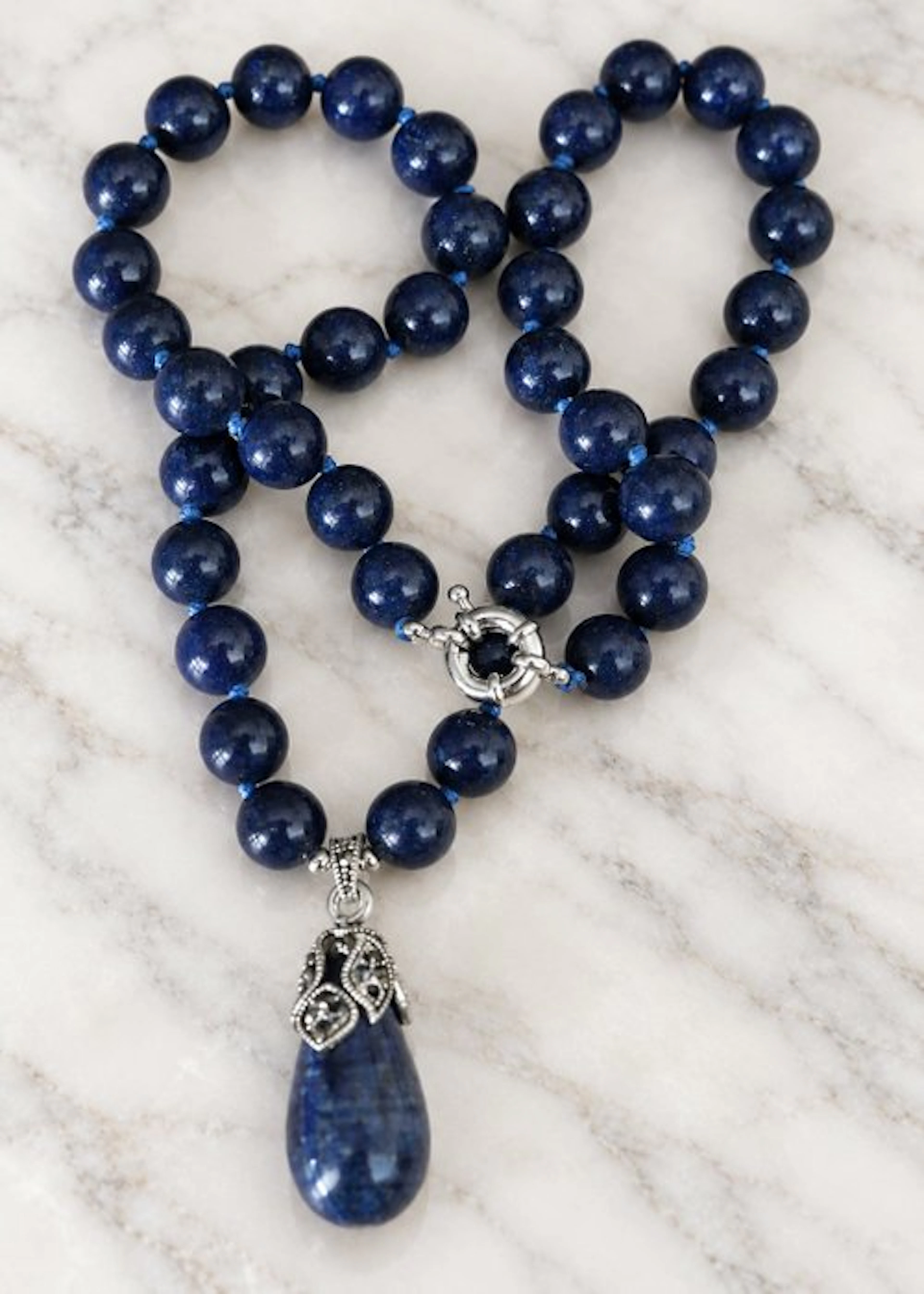 Necklace of natural Egyptian lapis-lazuli with a pendant...