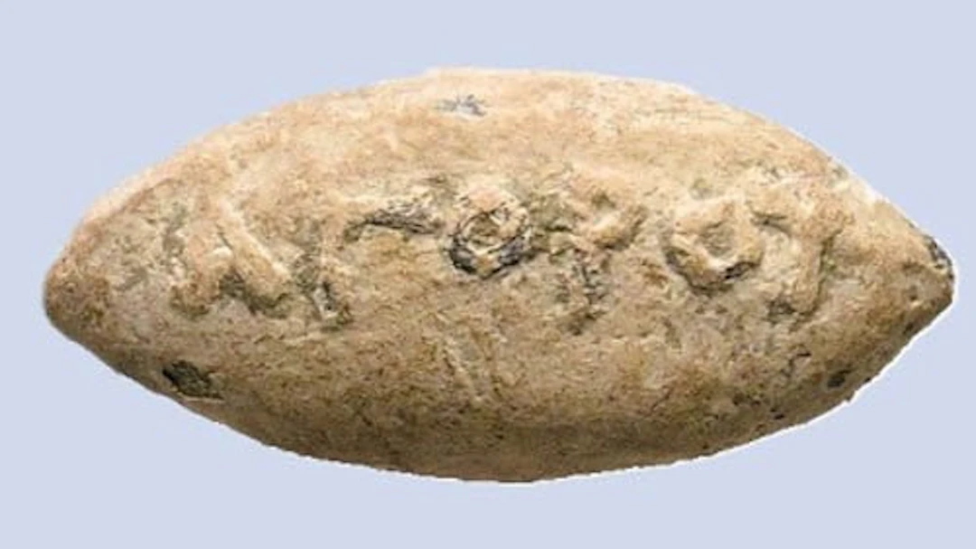 Ancient Greek -Lead sling bullet with image of a Greek...
