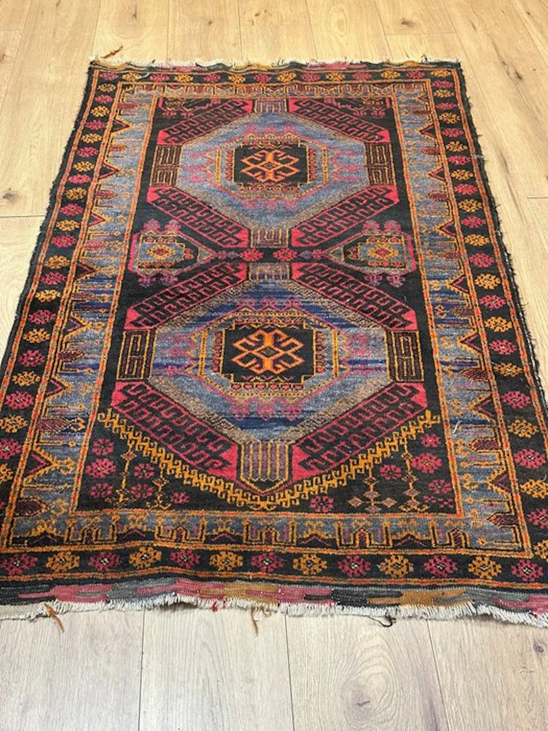 Classic hand-knotted Baluchi rug from Afghanistan with a...