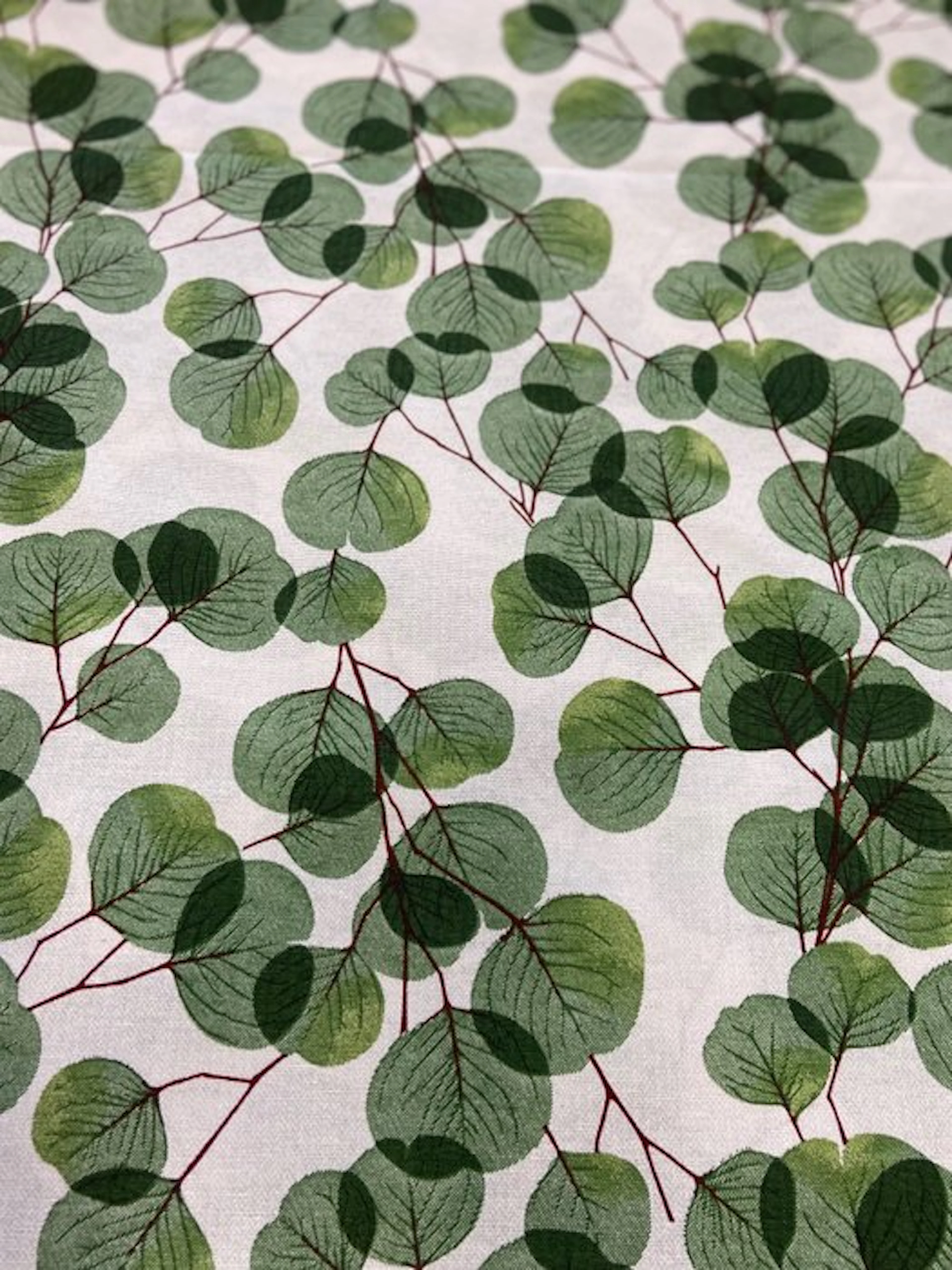 Fabric with eucalyptus leaves in double-height pile