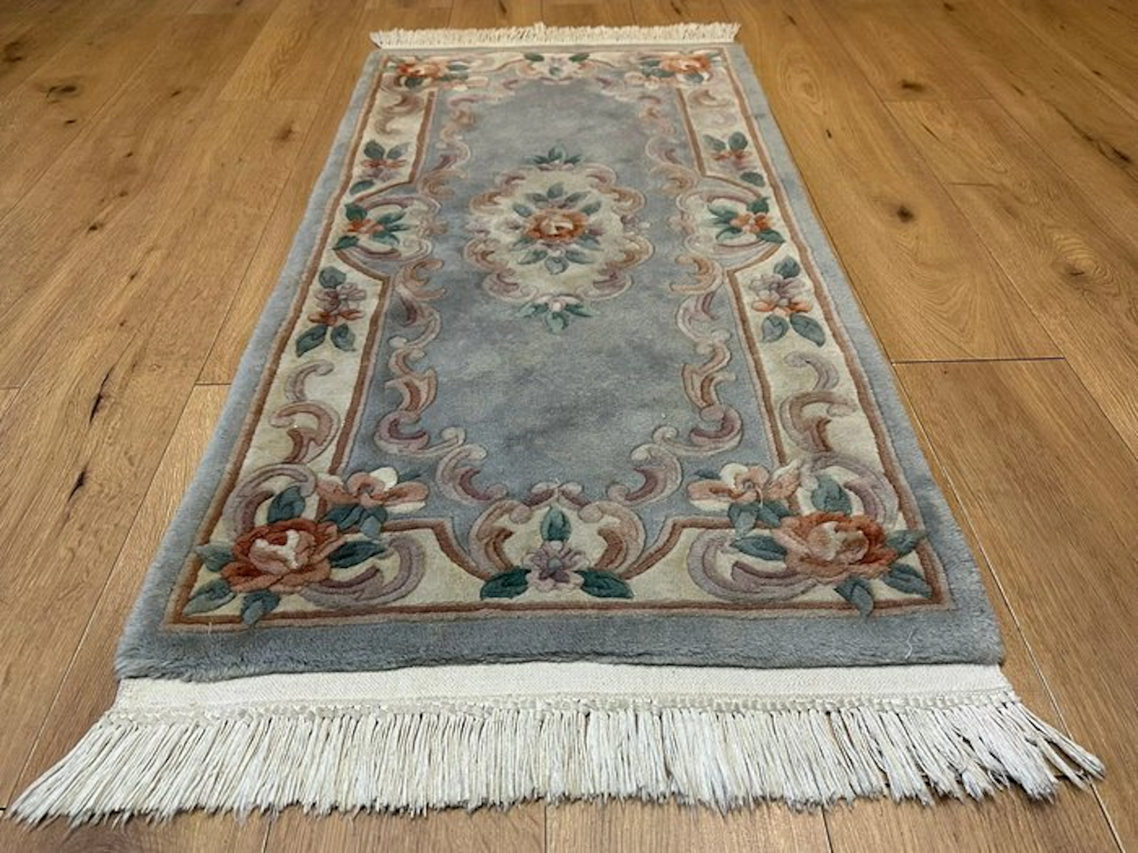 Elegant Chinese Aubusson rug with a classic rose pattern in soft pastel tones