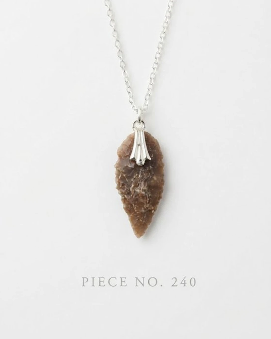 Musterian Silex arrowhead. With silver chain.