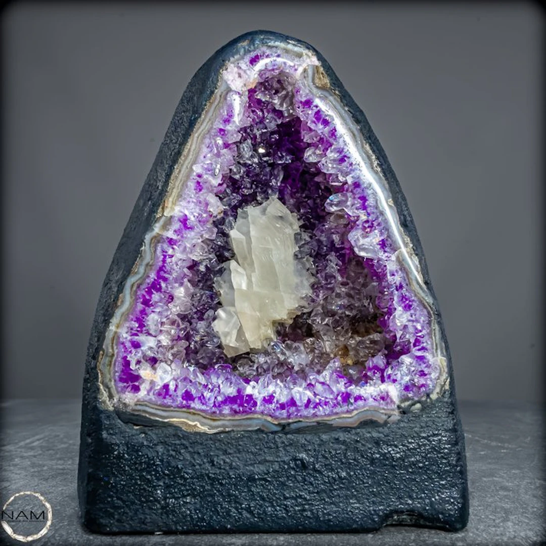 Natural amethyst crystal cathedral with calcite crystal...