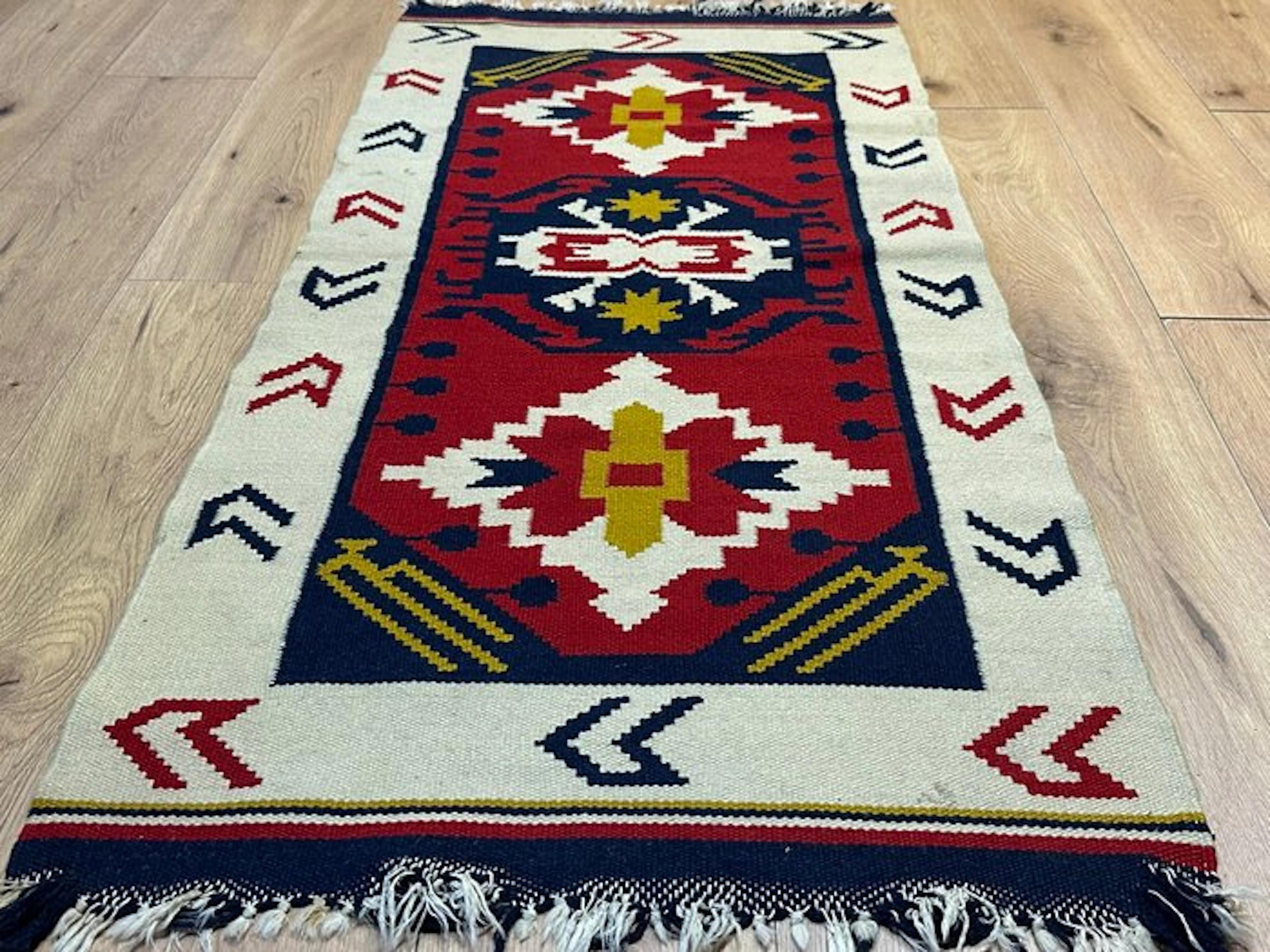Handwoven Kilim Kazak rug with geometric medallion pattern