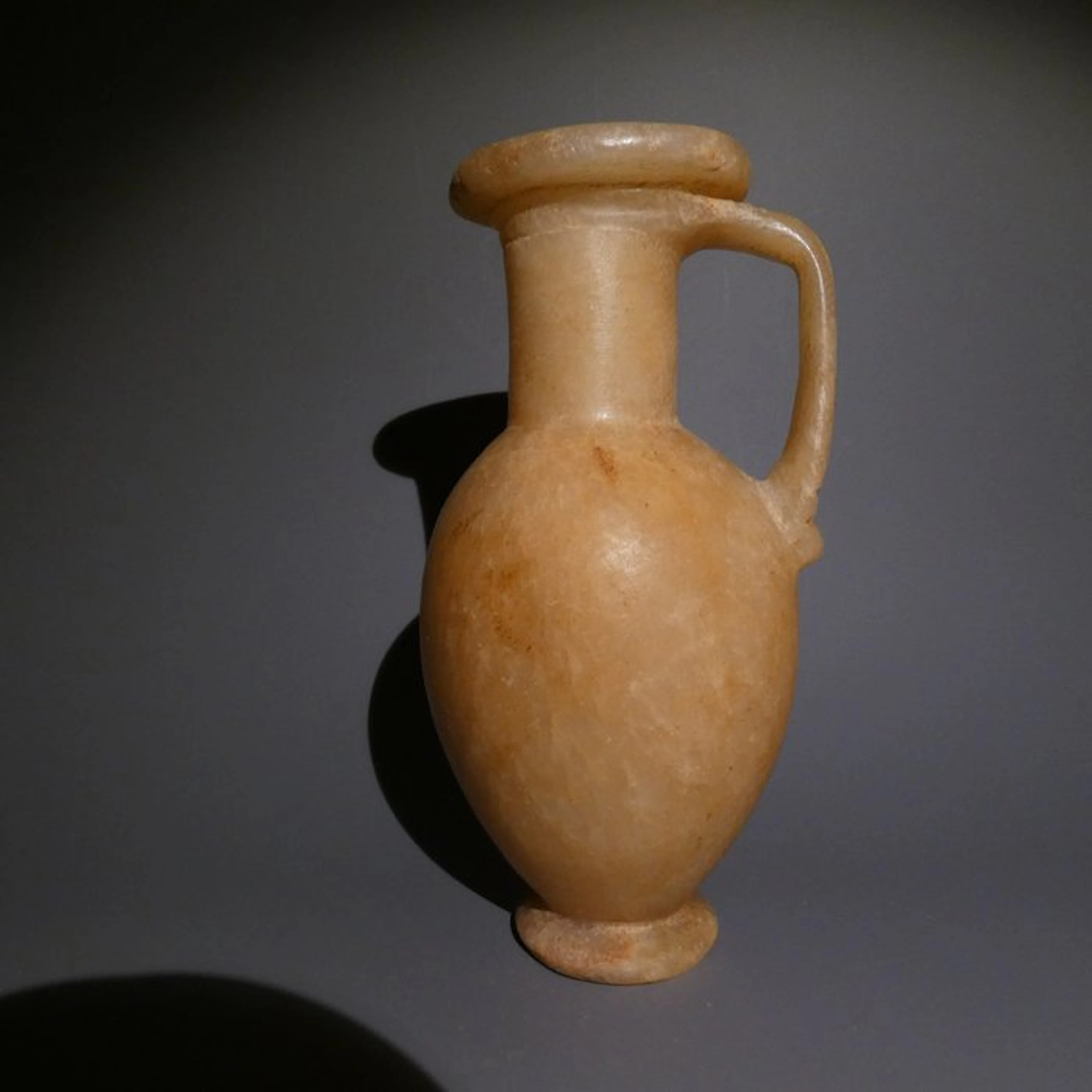 Ancient Egyptian Alabaster Pitcher. 17 cm H. New Kingdom, c. 1550 -1069 B.C.