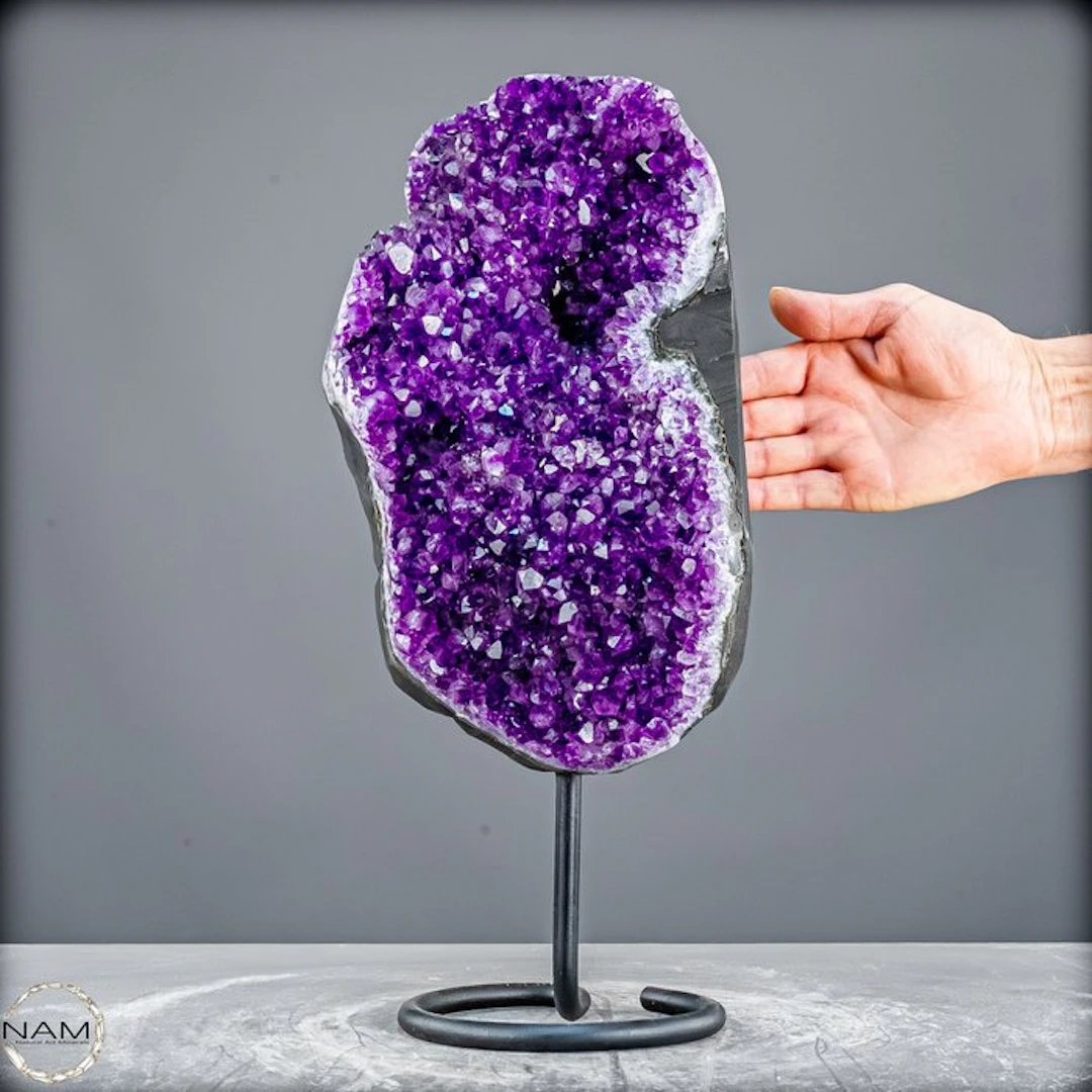 Radiant amethyst on a metal stand – elegance in violet splendor