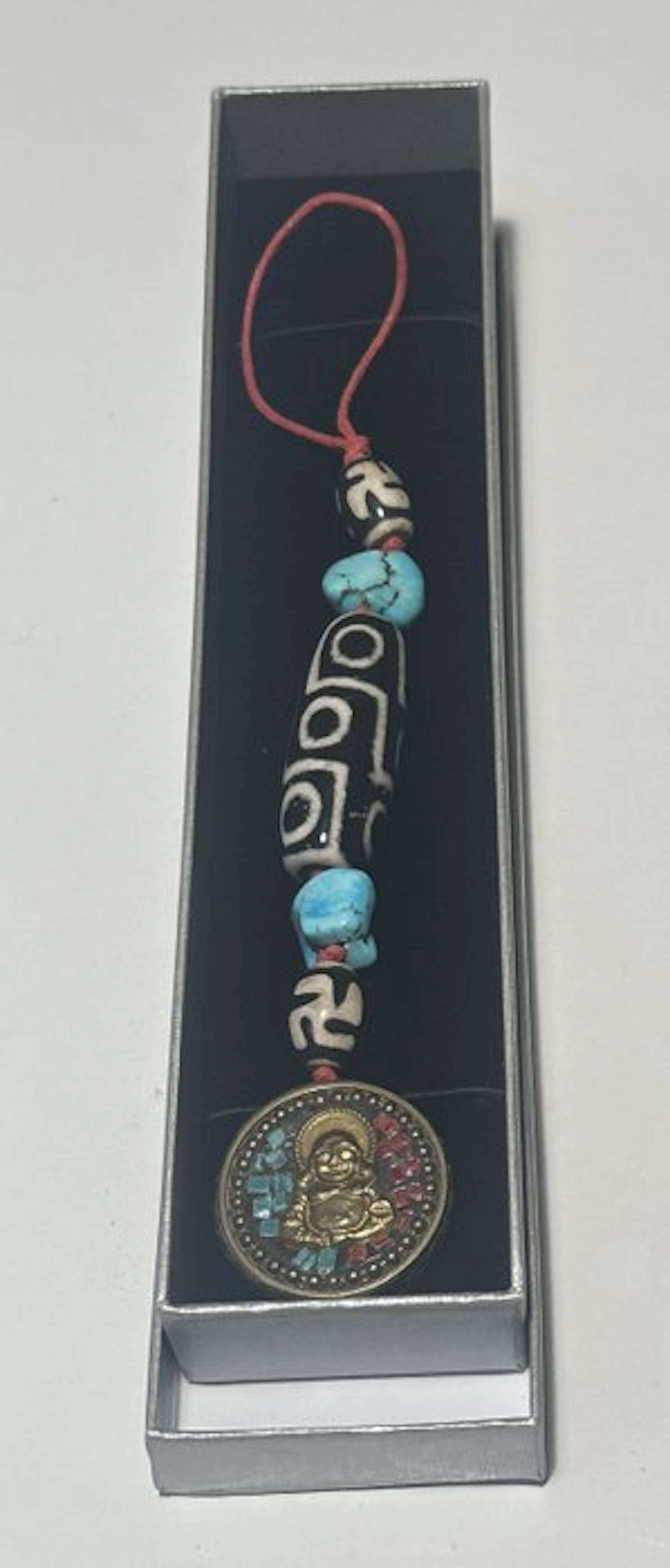 Turquoise with Dzi amulets '9 eyes'; 'Swastika' and 'Buddha'