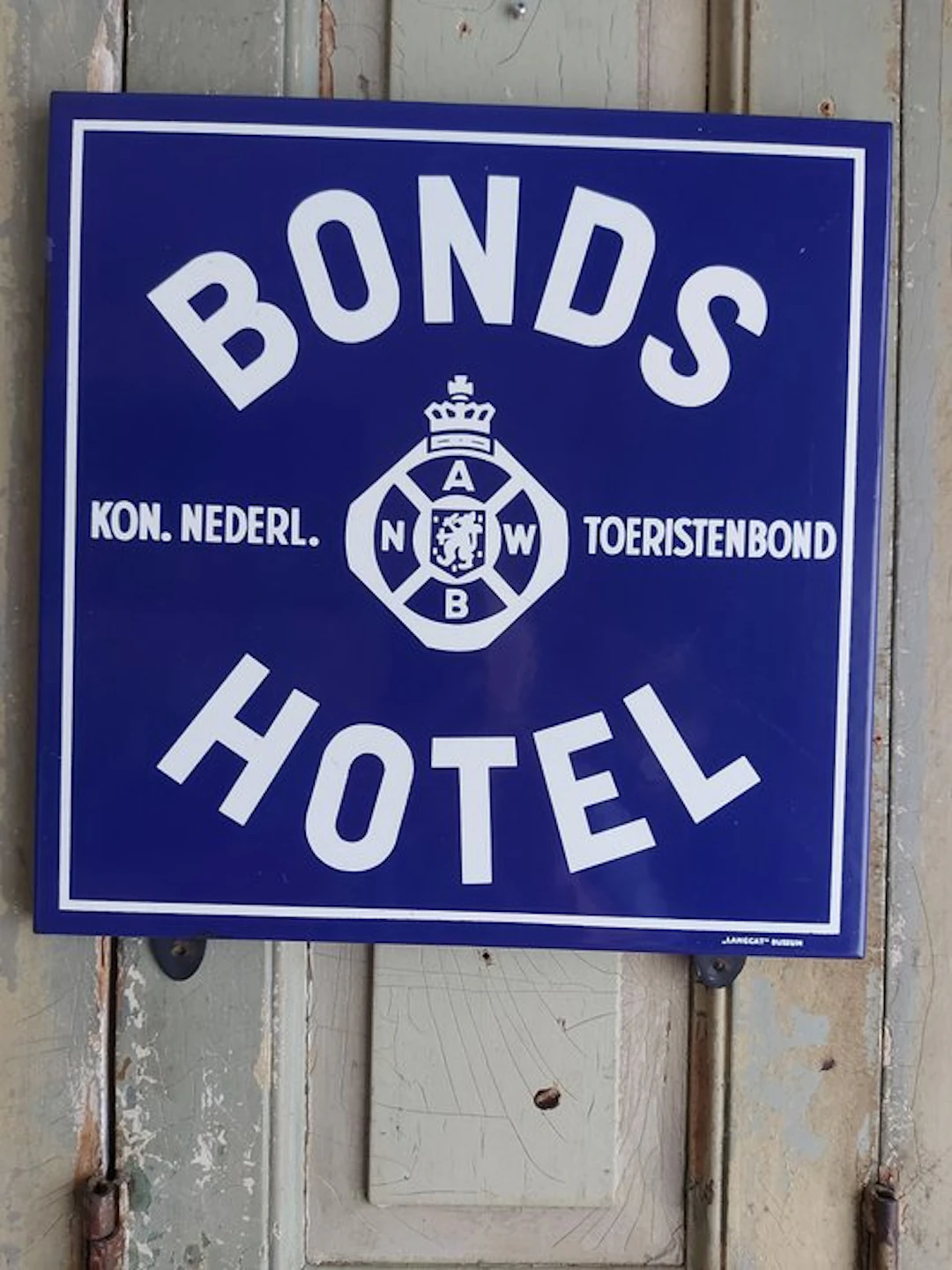 Vintage enamel advertising sign for an ANWB association...