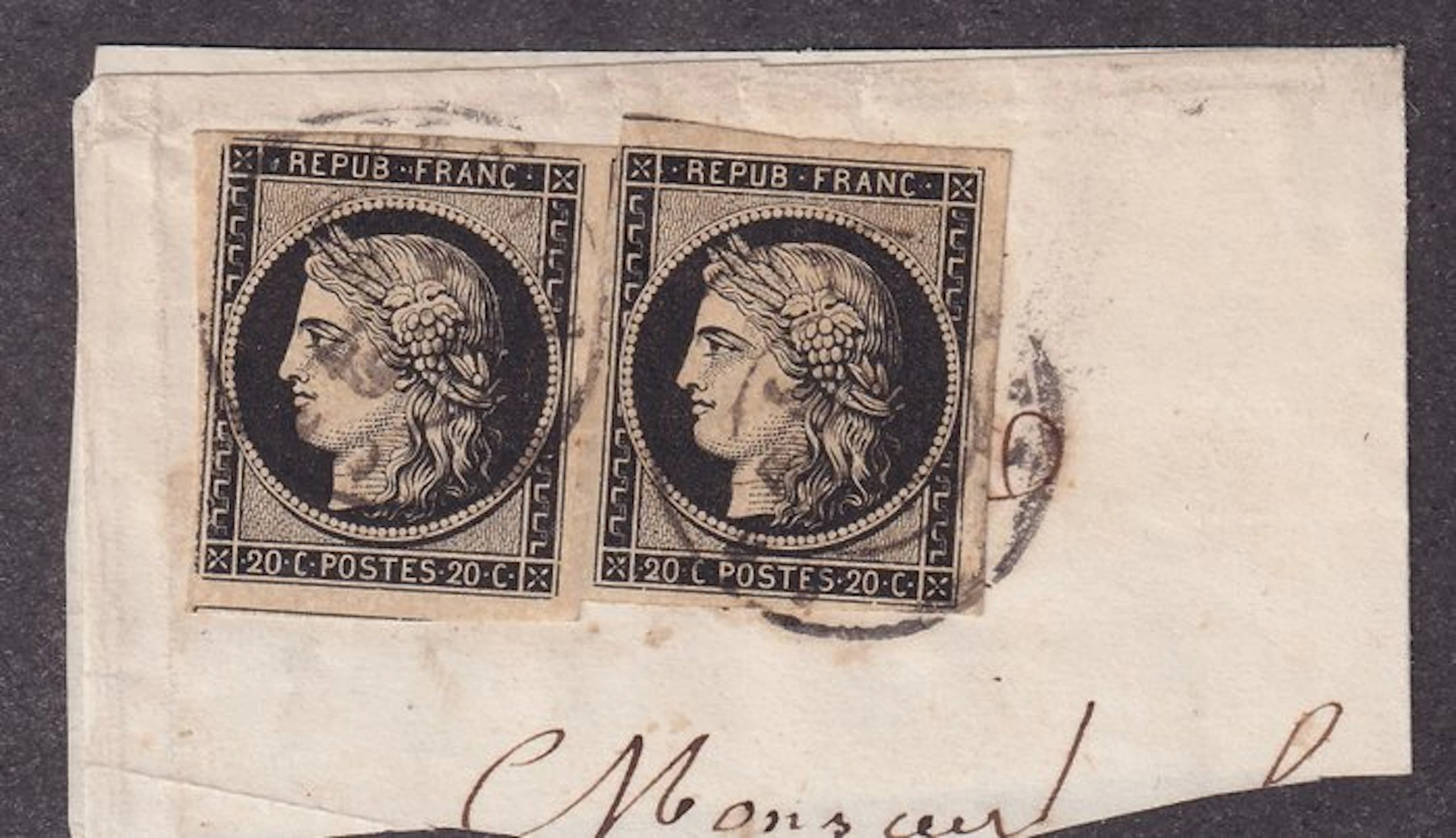 France - two 20c black stamps on an obliterated fragment