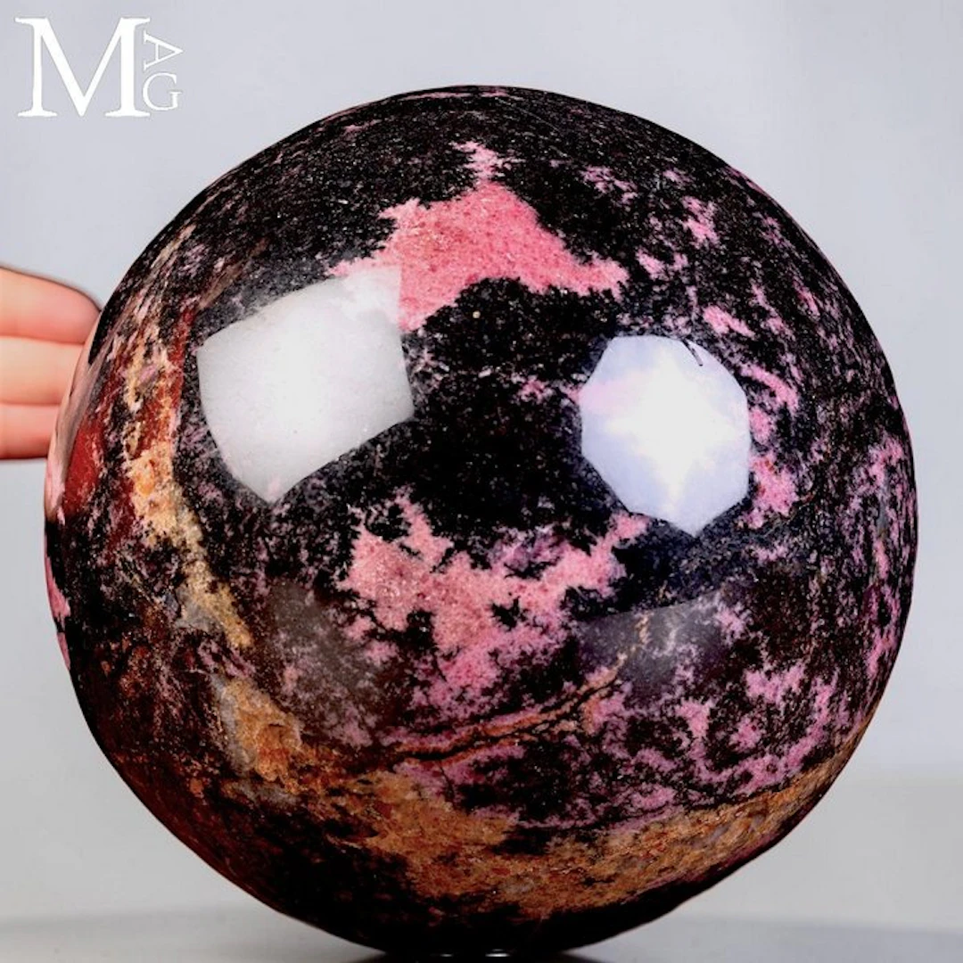 Exquisite Rhodonite Sphere - vibrant pink - black...