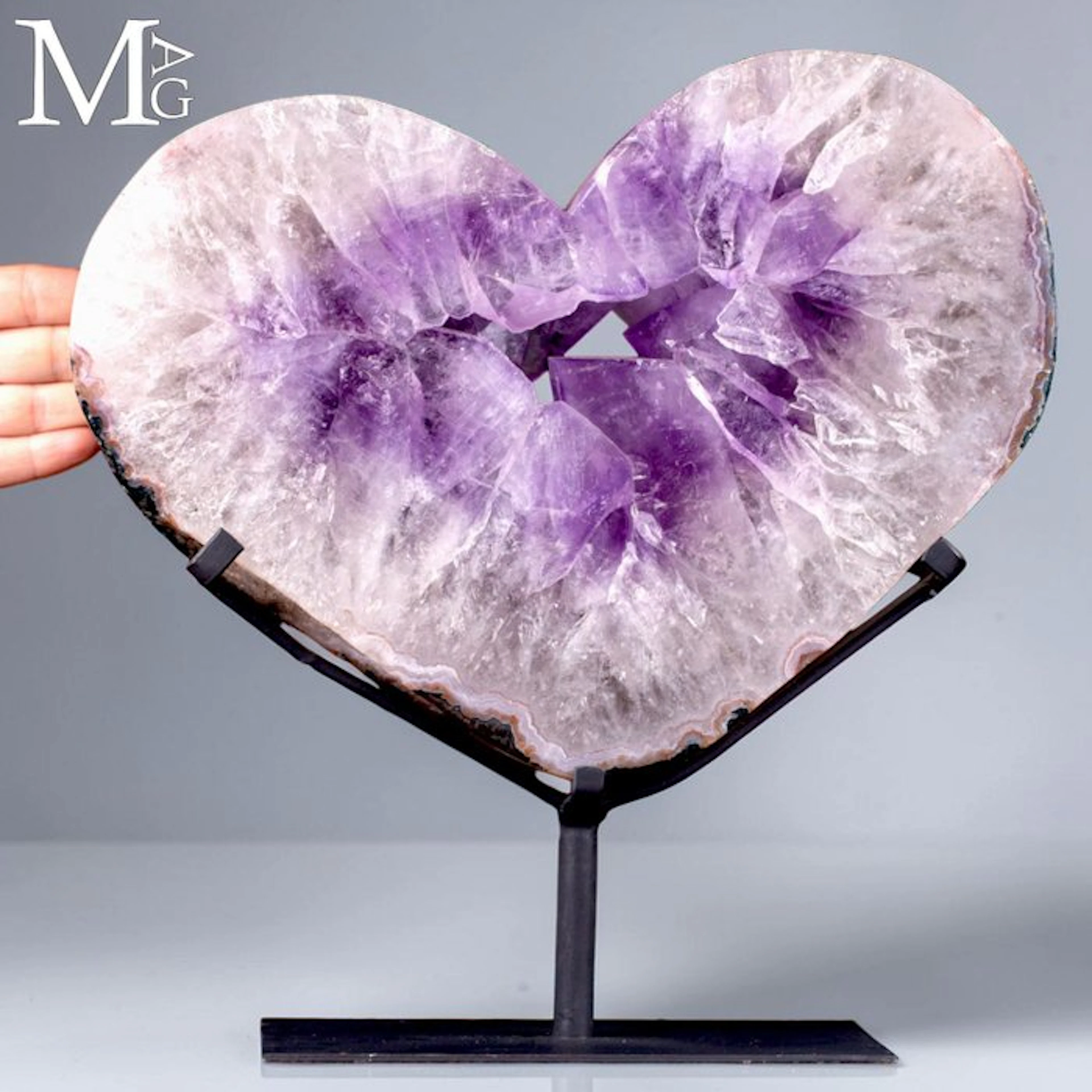 Large slice of Brazilian amethyst geode with a deep purple crystal cavity
