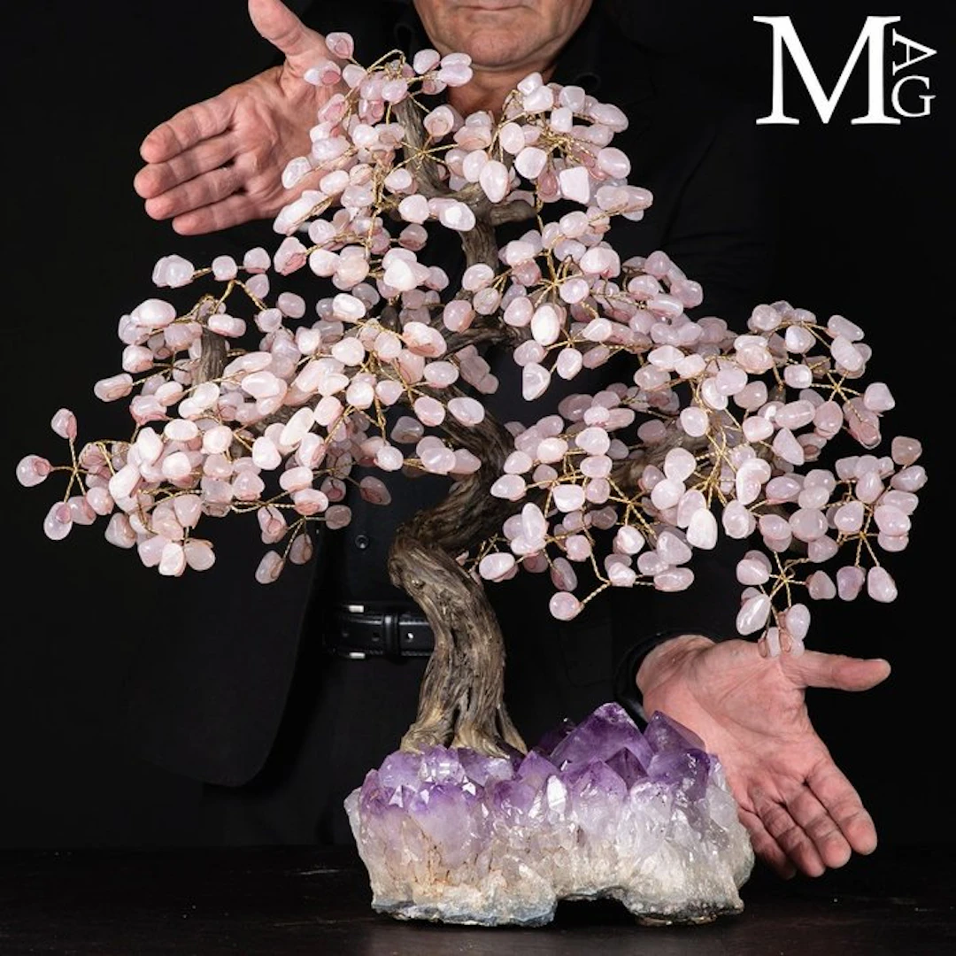 Large handmade rose quartz tree on a base of intense...