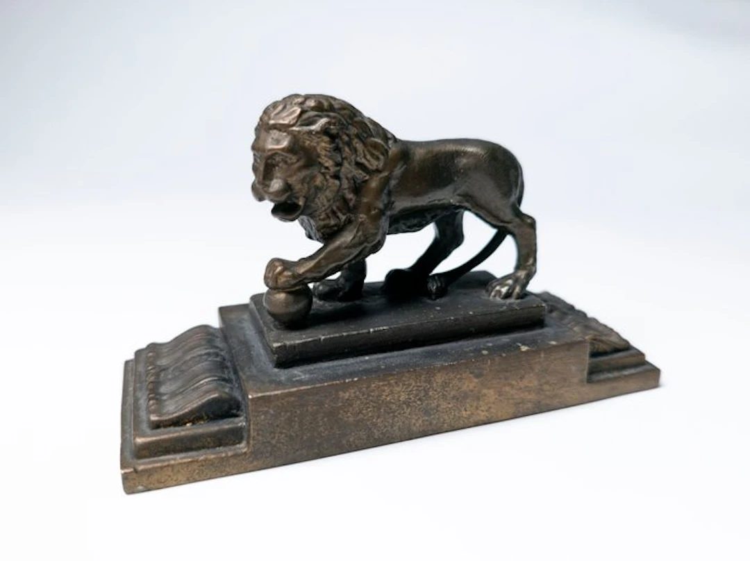 Lion with a Ball - figurine