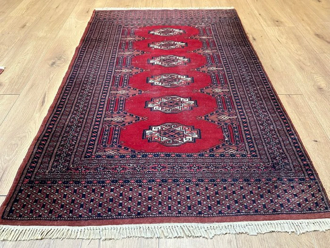 Hand-knotted Pakistani Bukharan Oriental rug with a...