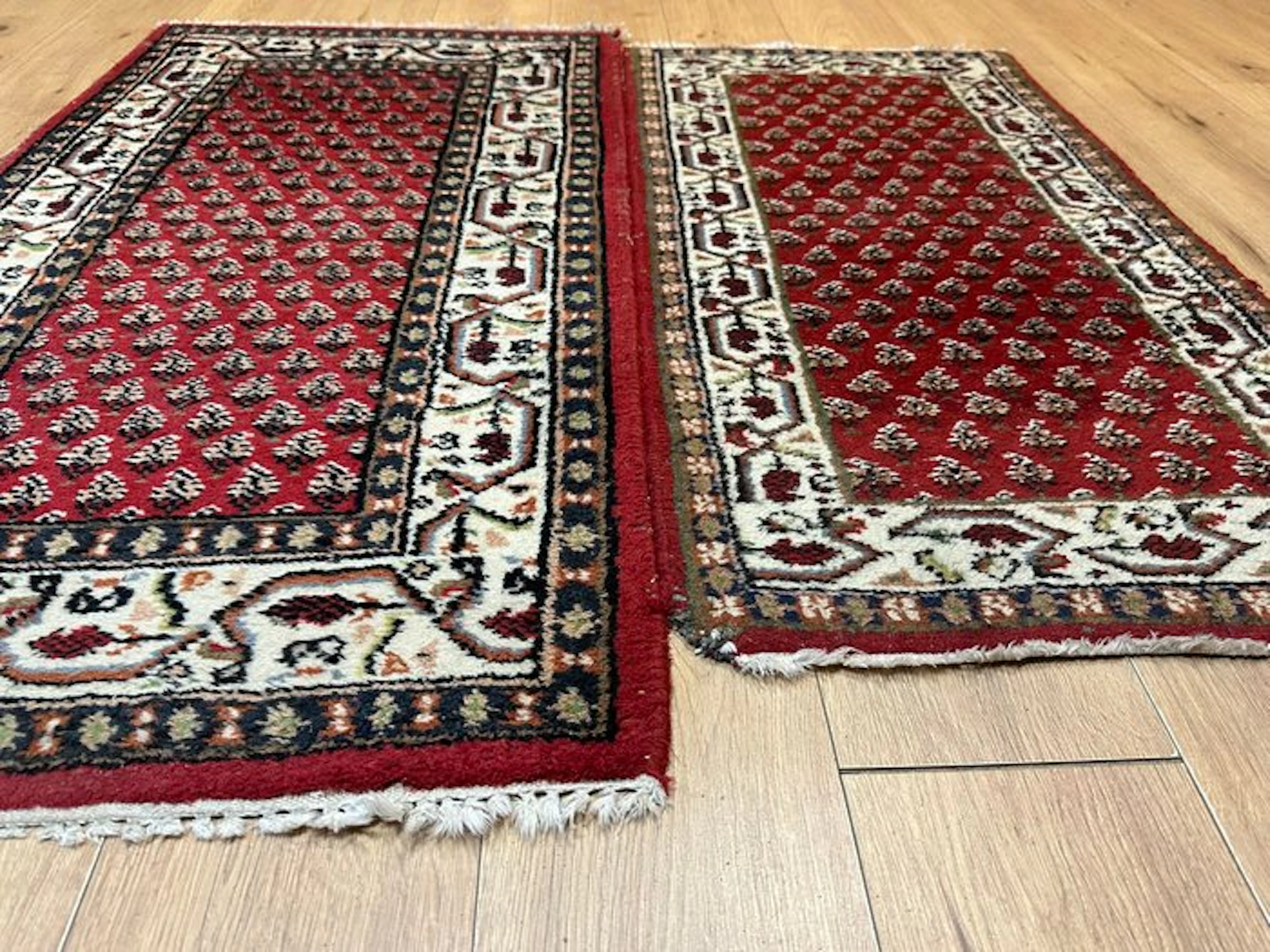 Beautifully hand-knotted pair of carpets in the classic...