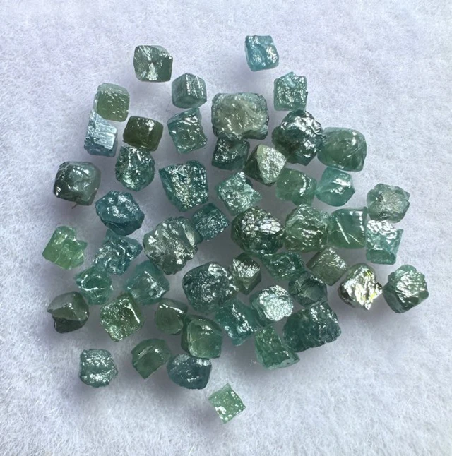 Lot of 50 small blue diamonds - 2.35 carats Rough- 0.47 g