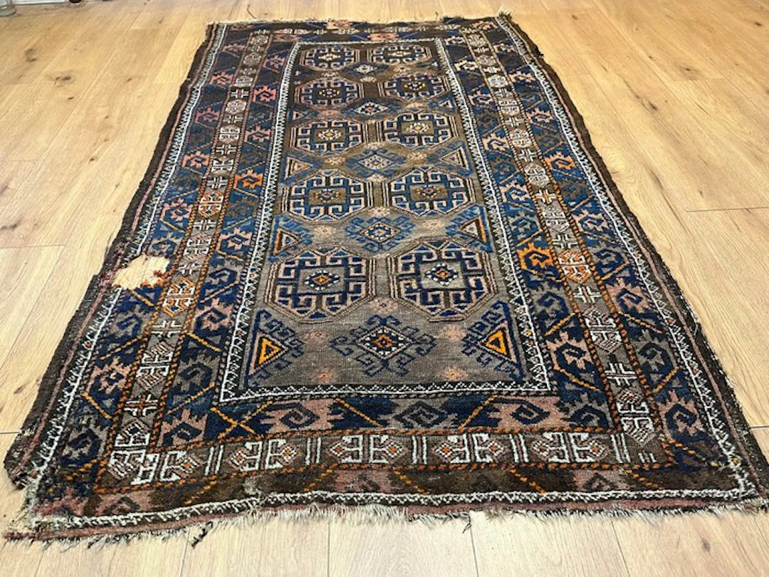 Hand-knotted Baluch carpet from Afghanistan with a classic octagonal pattern