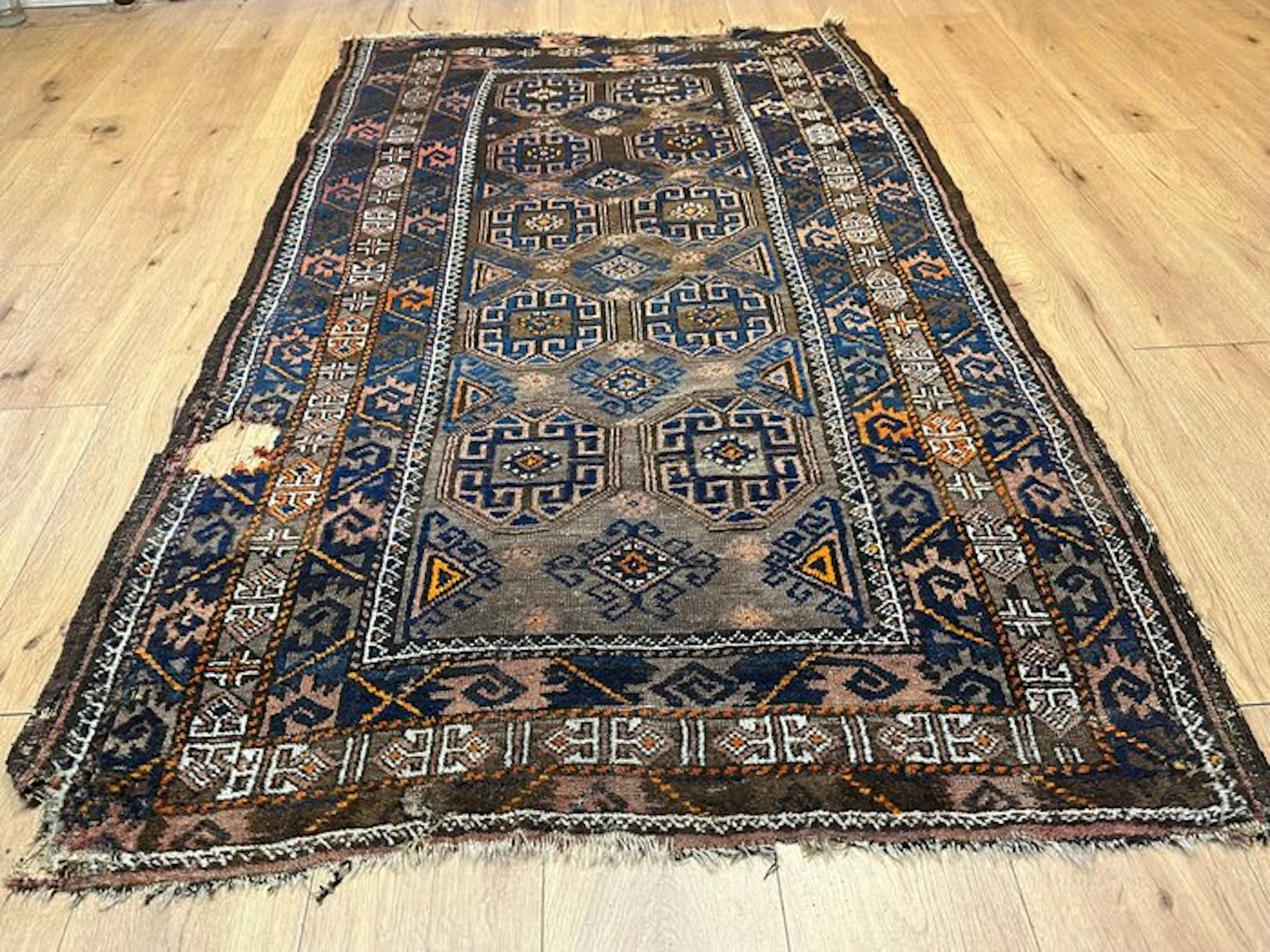 Hand-knotted Baluch carpet from Afghanistan with a classic octagonal pattern
